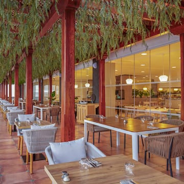 a restaurant with tables and chairs
