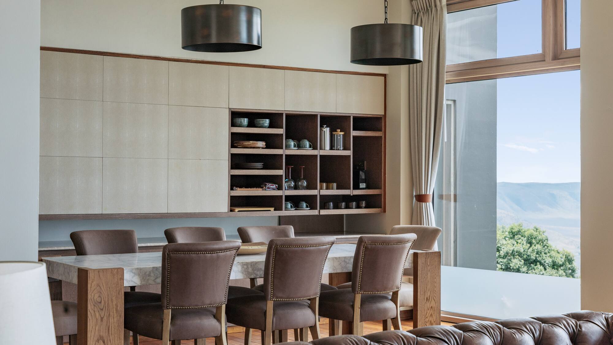 a dining room with a table and chairs