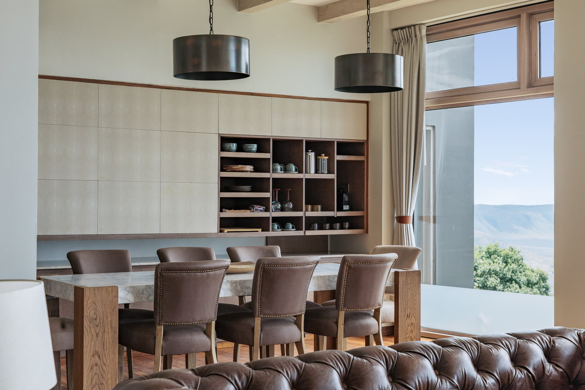 a dining room with a table and chairs