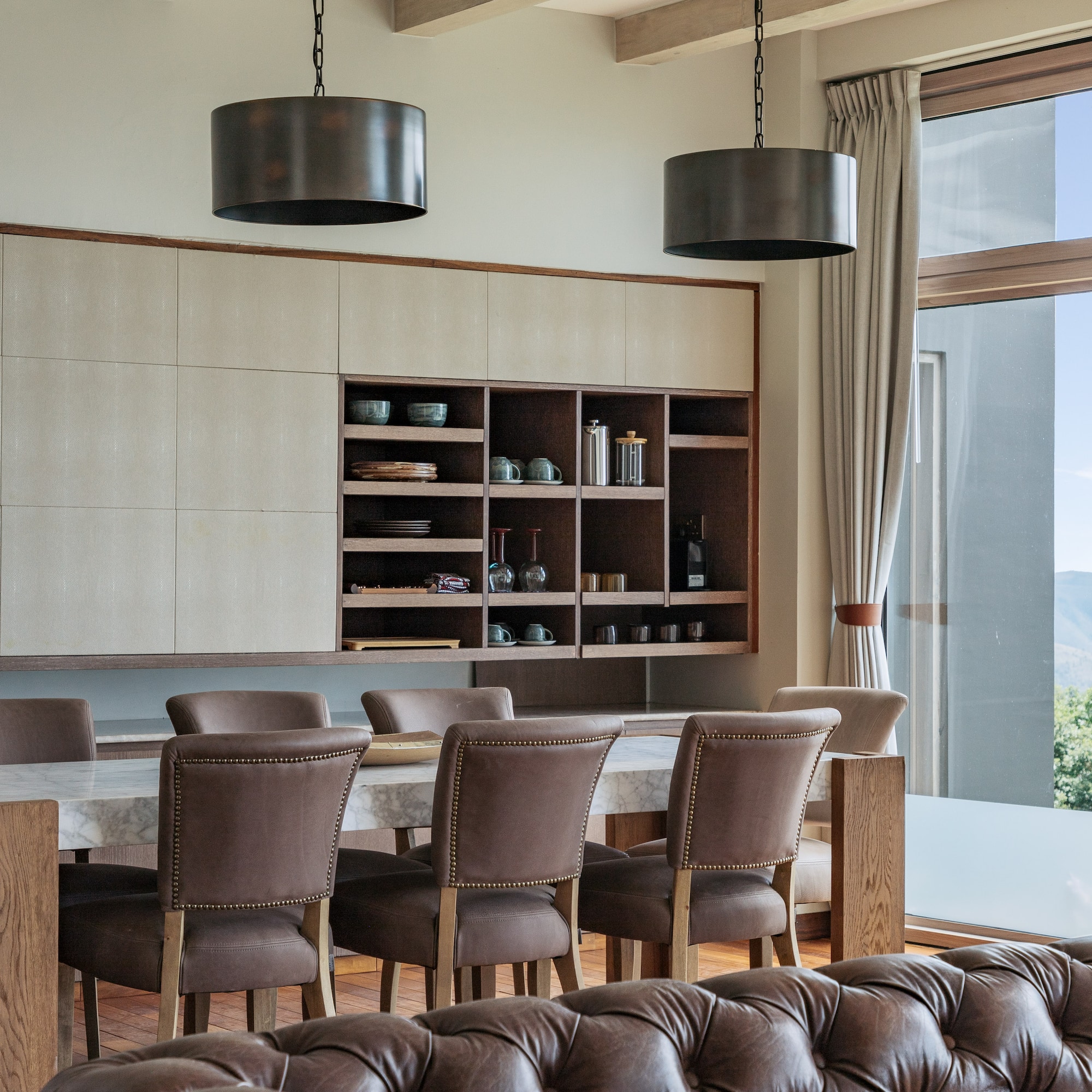 a dining room with a table and chairs