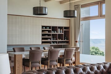 a dining room with a table and chairs