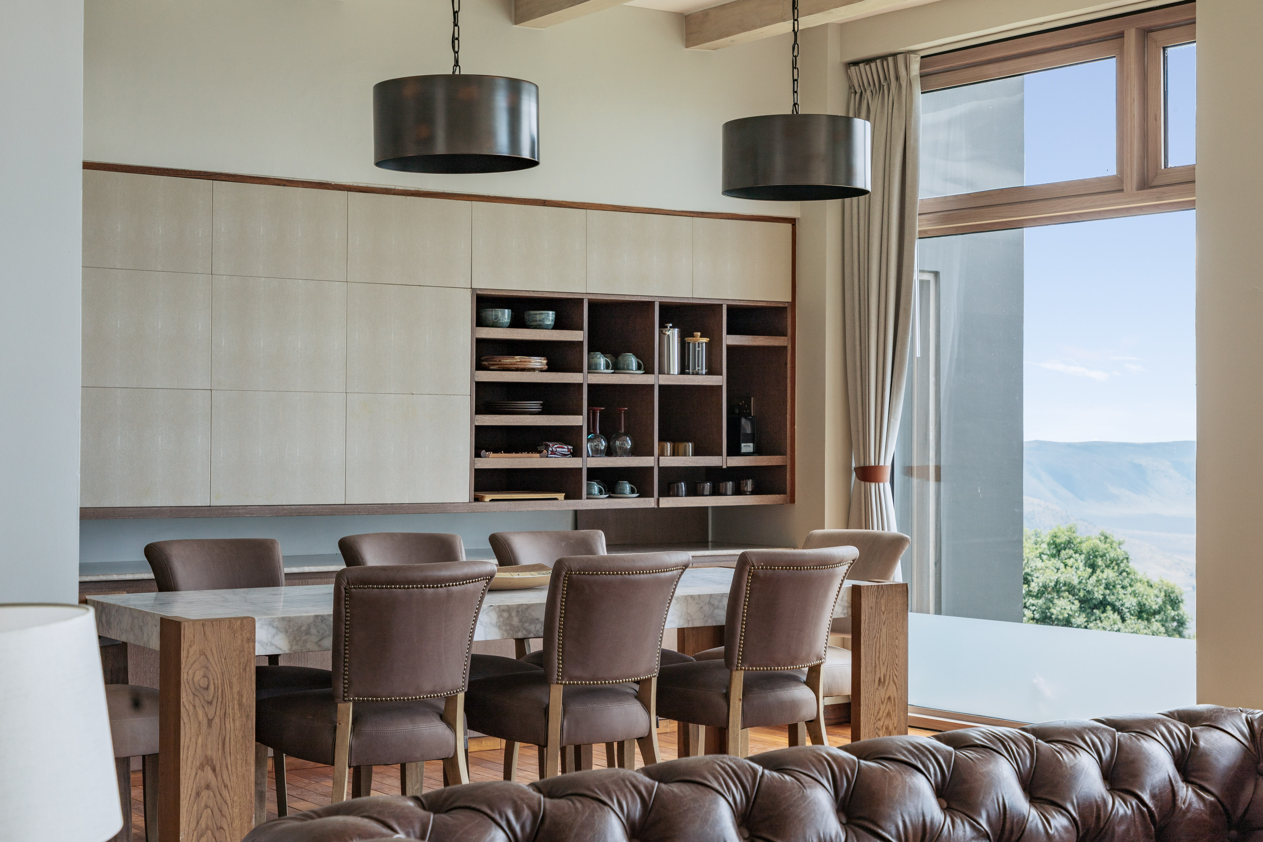 a dining room with a table and chairs