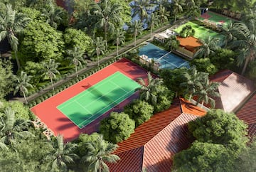 a tennis court surrounded by trees