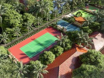 a tennis court surrounded by trees