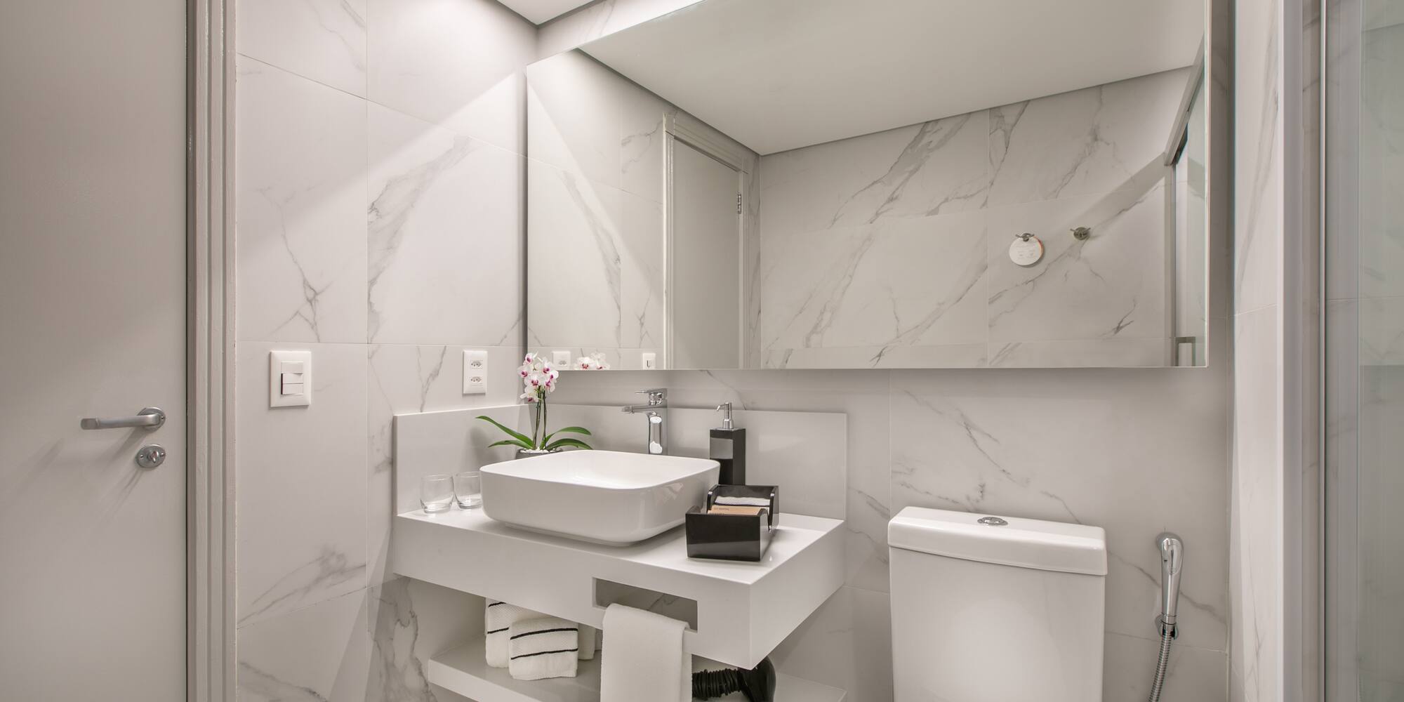 a bathroom with a sink and toilet