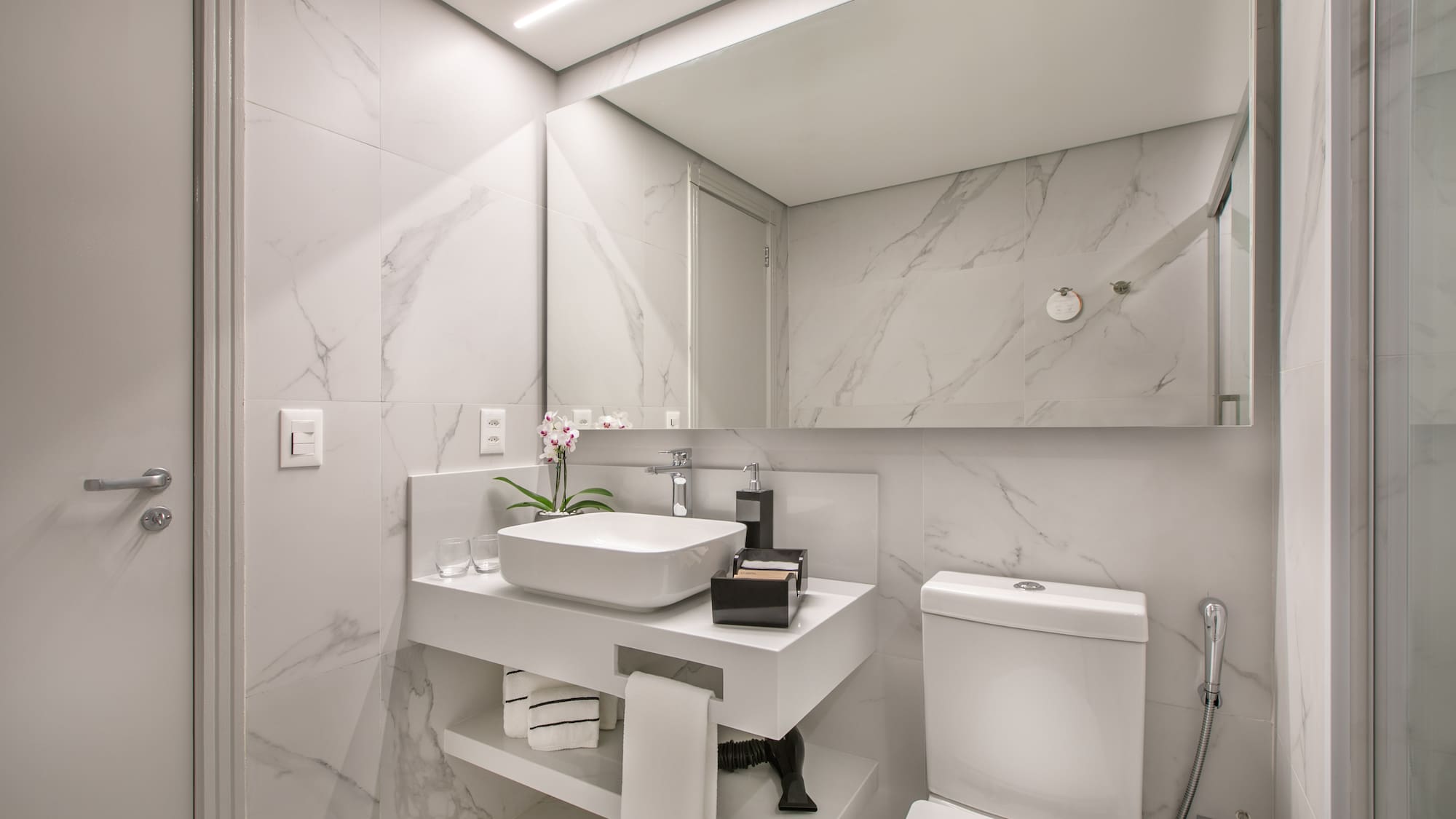 a bathroom with a sink and toilet