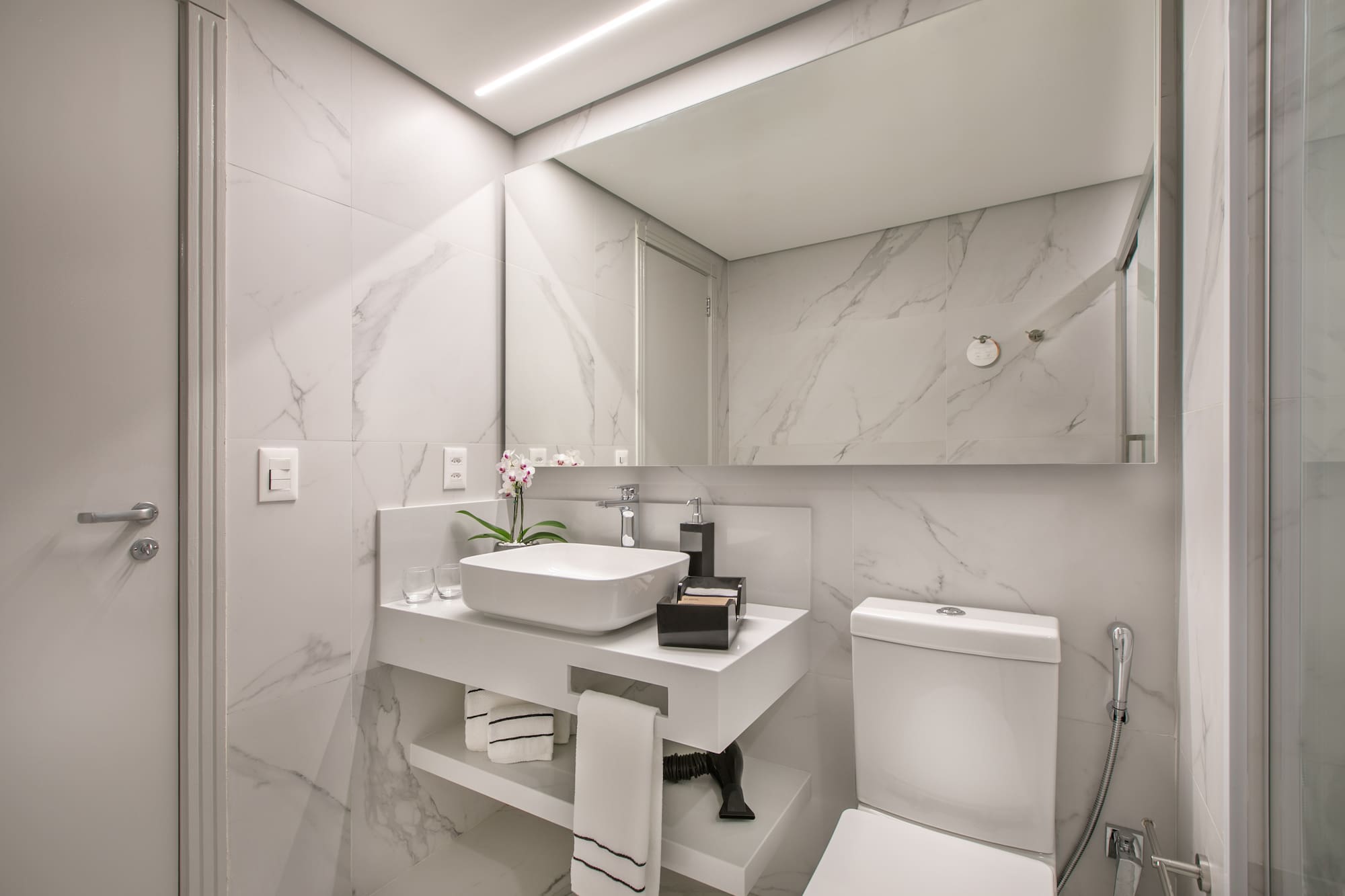 a bathroom with a sink and toilet