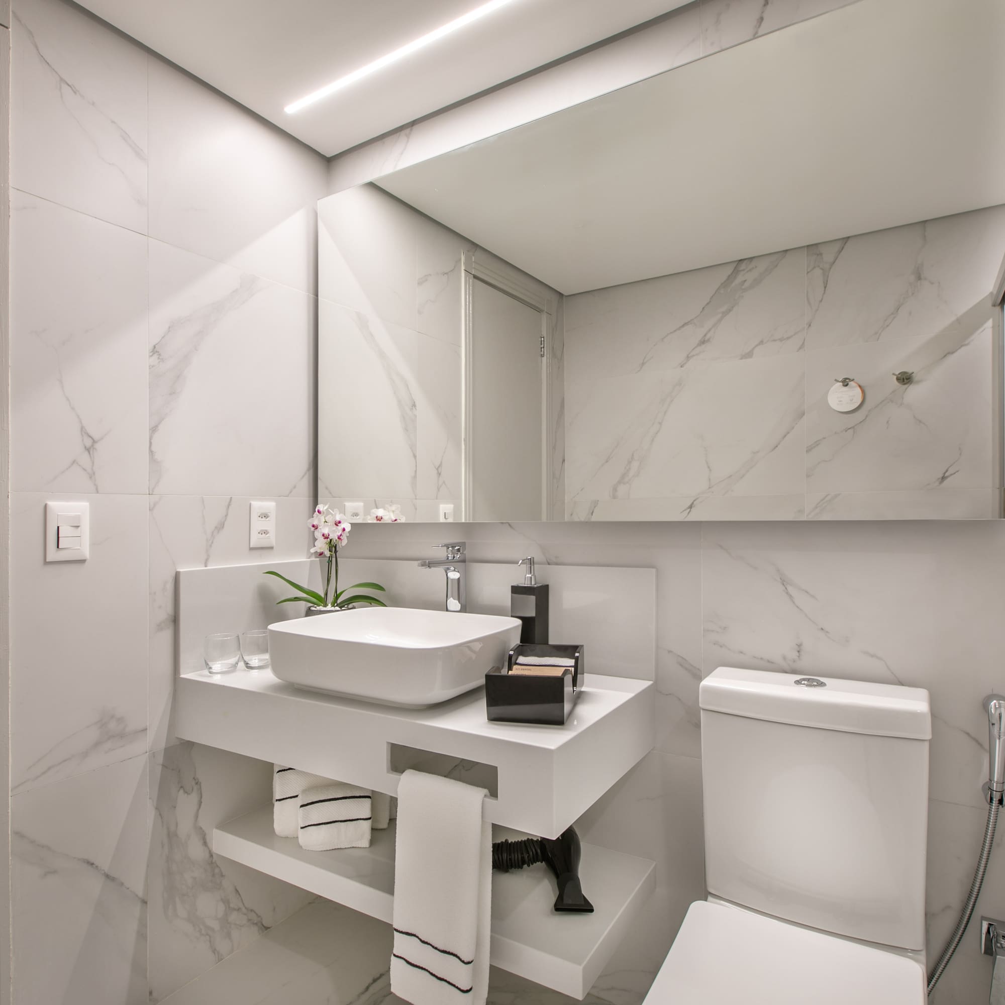 a bathroom with a sink and toilet