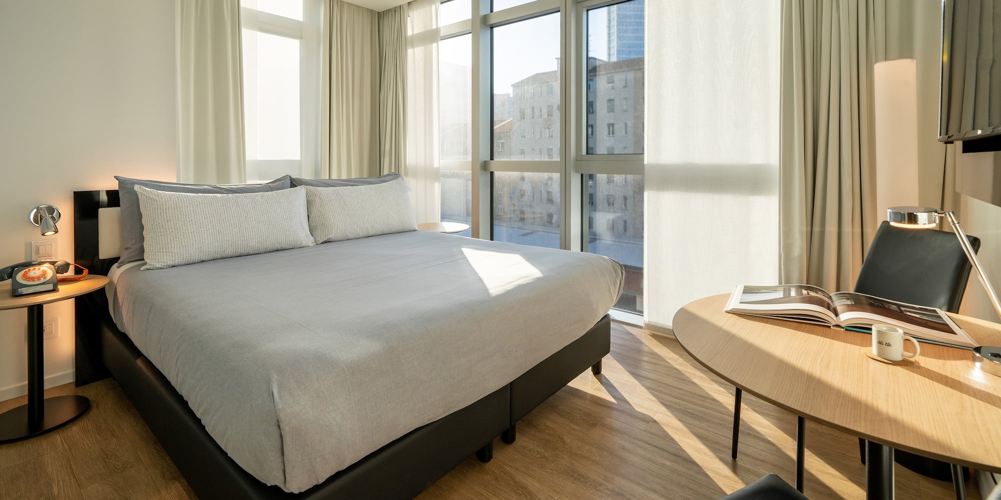 a bedroom with a bed and a table