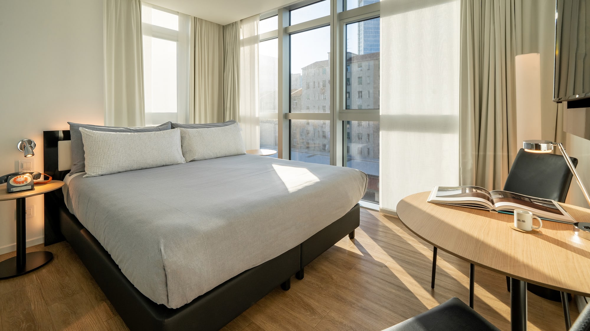 a bedroom with a bed and a table