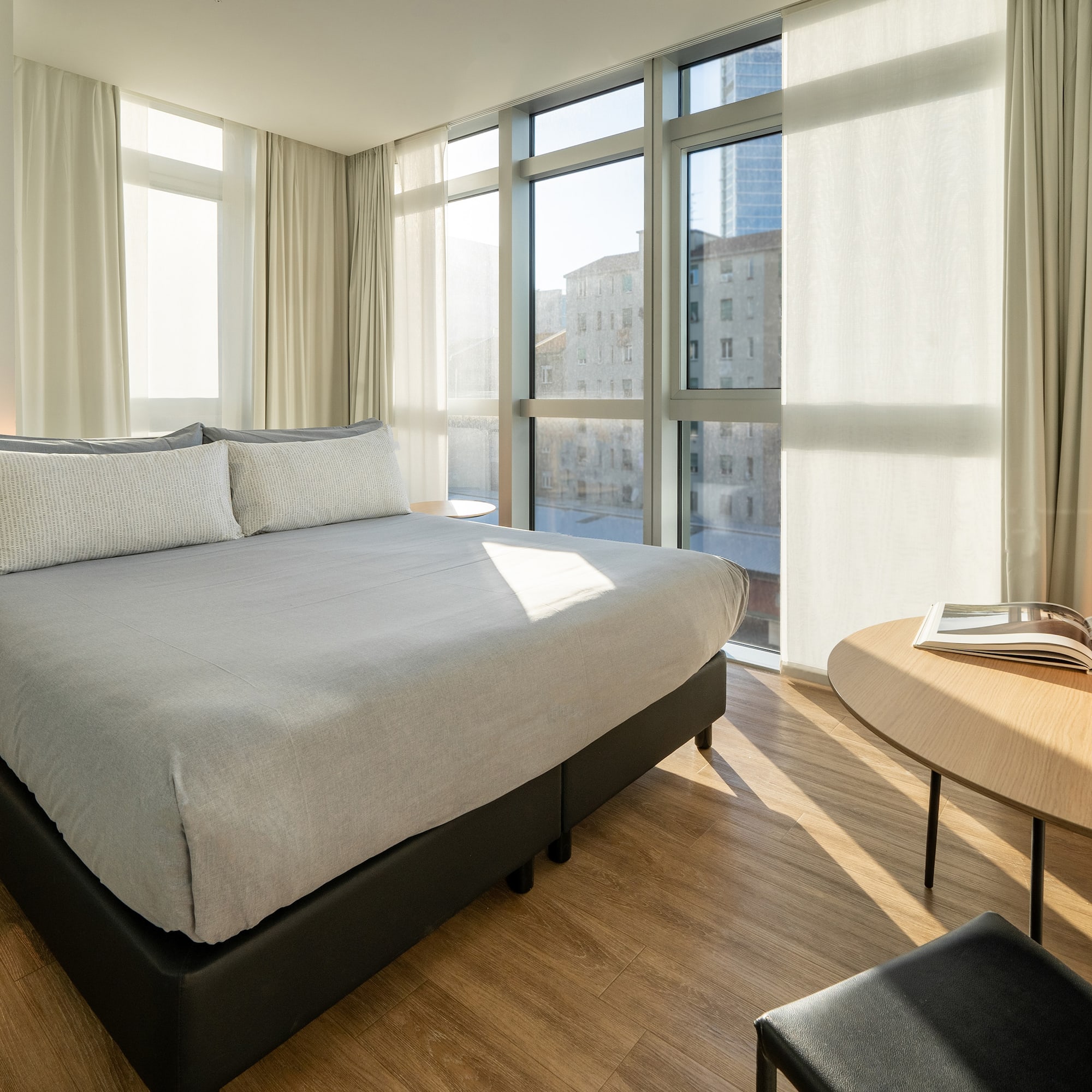 a bedroom with a bed and a table