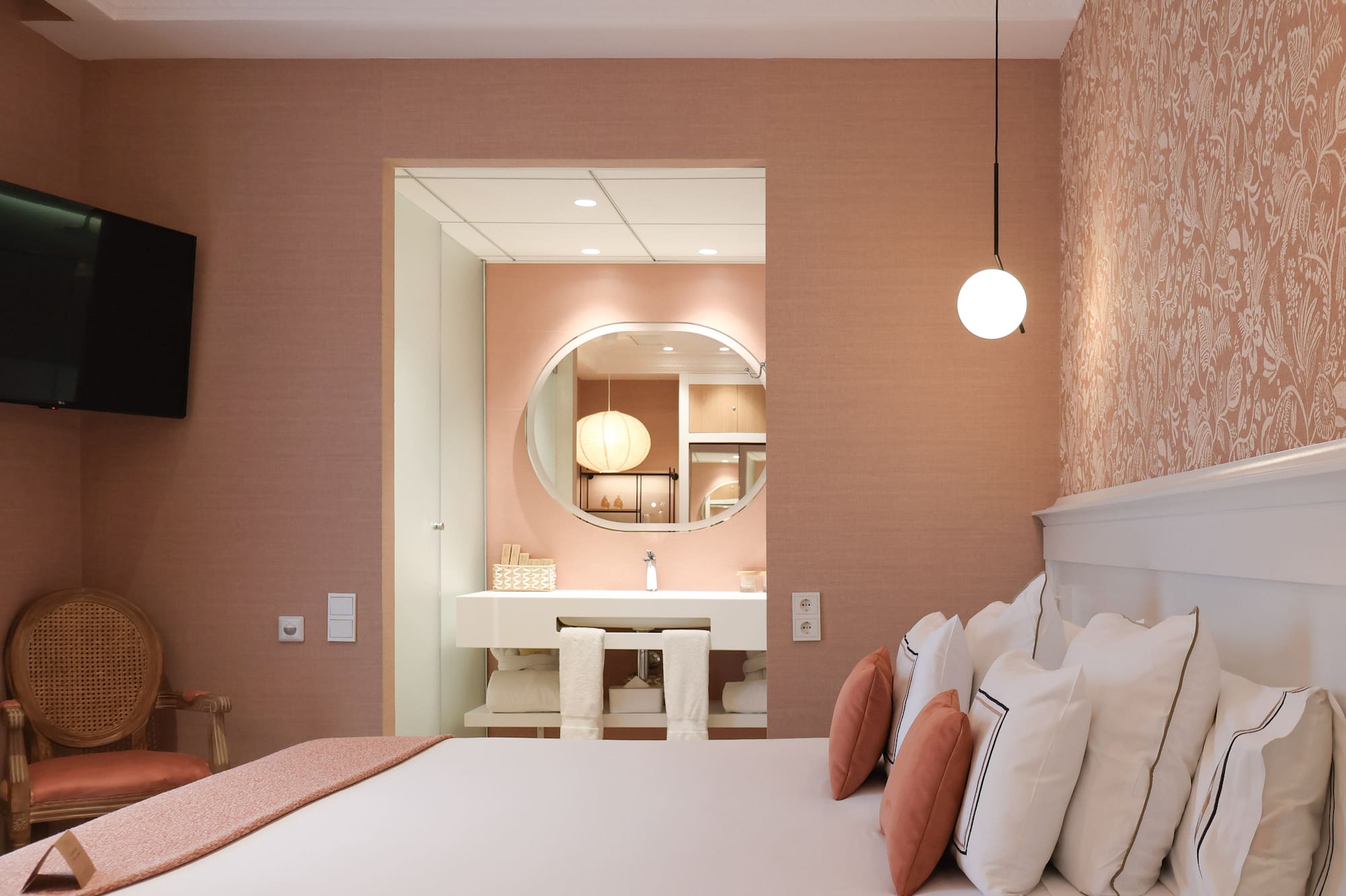 a room with a bed and a mirror