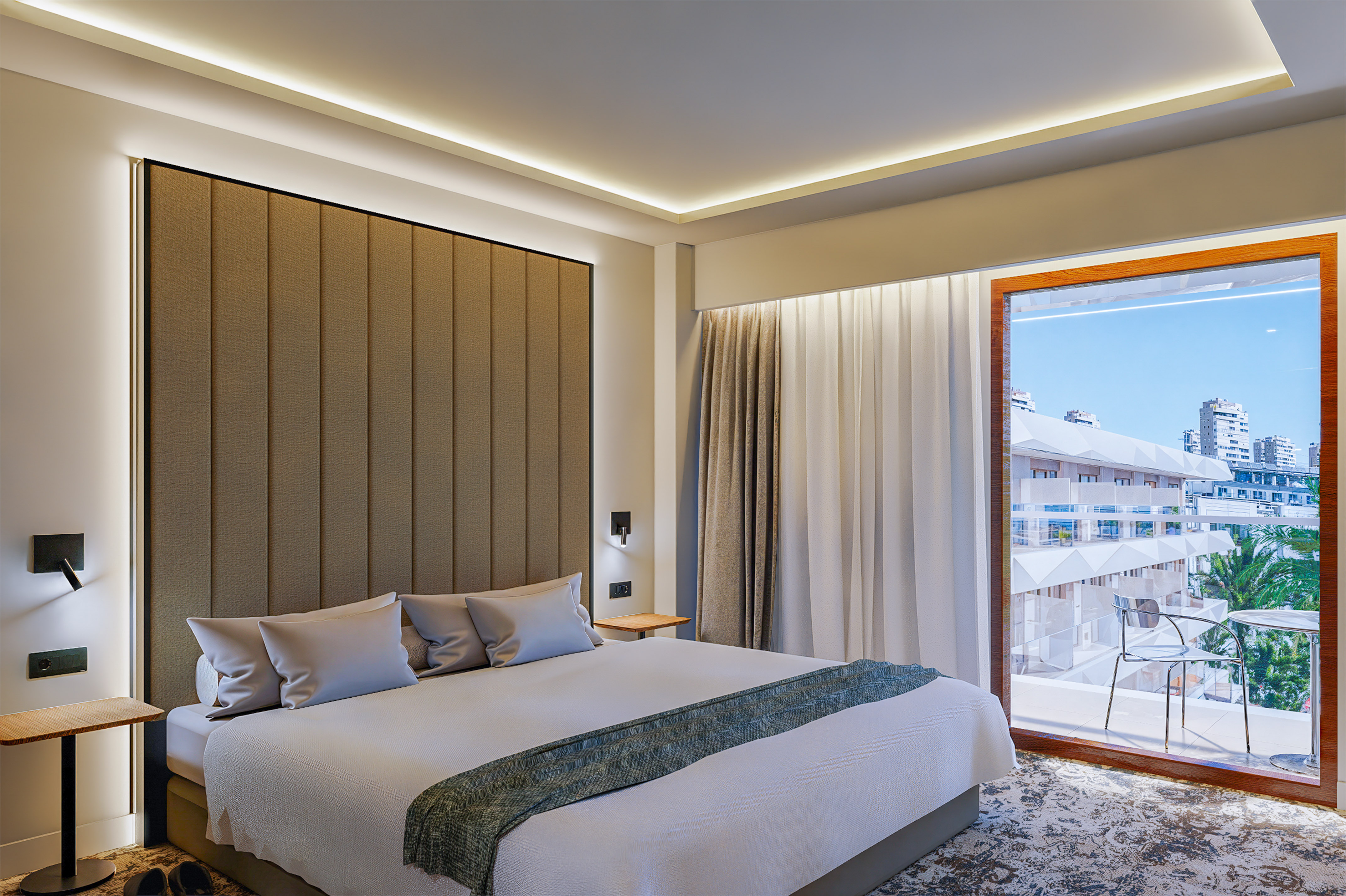 a bed with pillows and towels on it