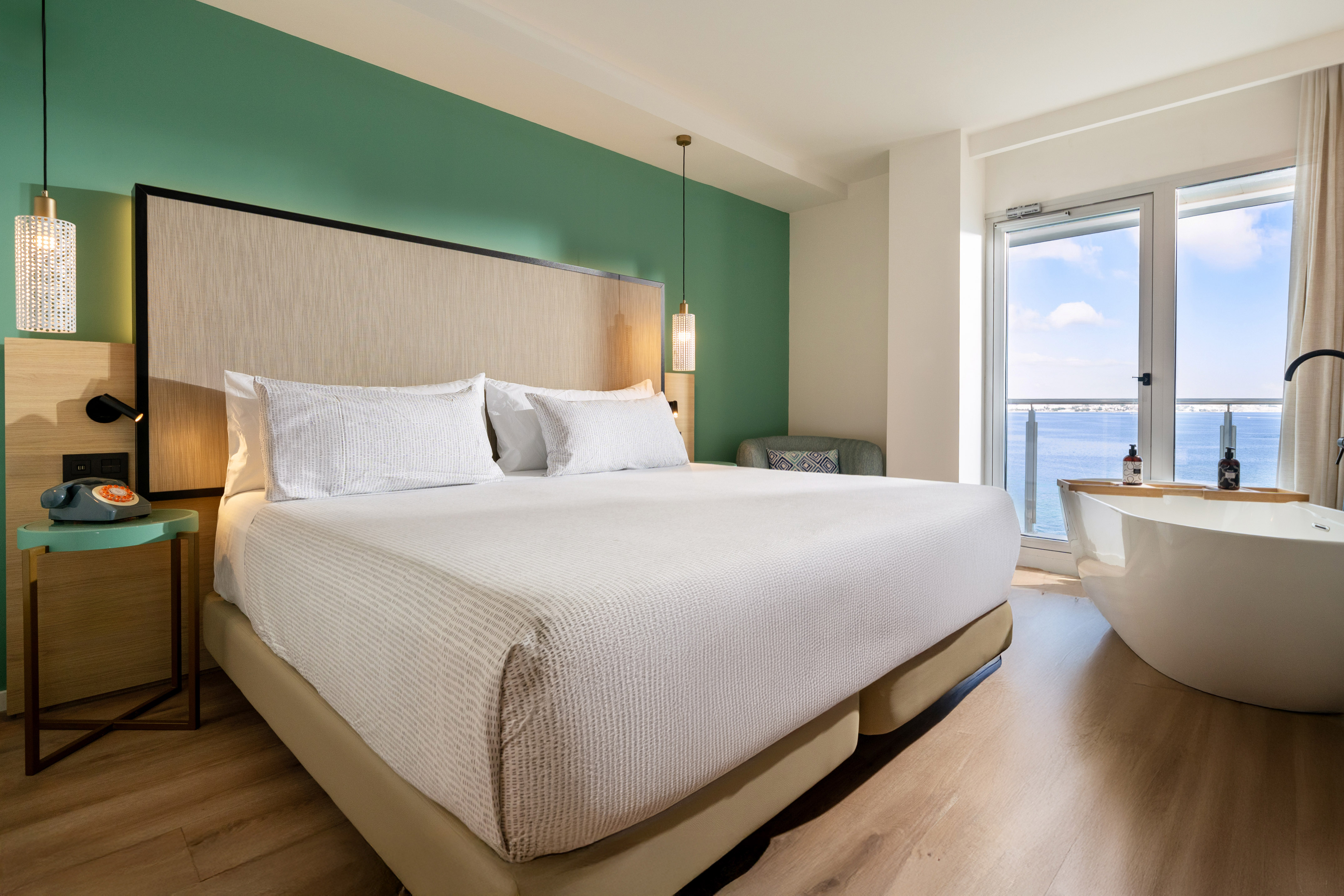 a bed with a tub and a window