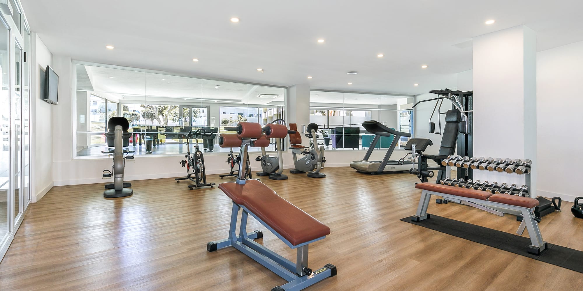 a large room with exercise equipment