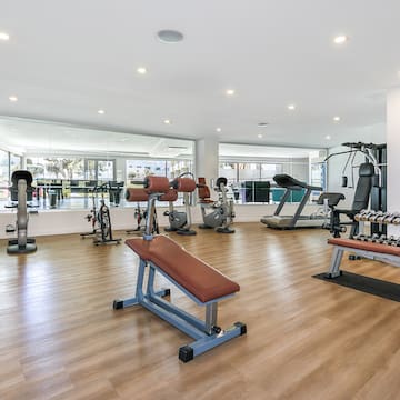 a large room with exercise equipment