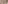 Modern hotel suite living area, kitchenette, wood fan, and resort style decor.