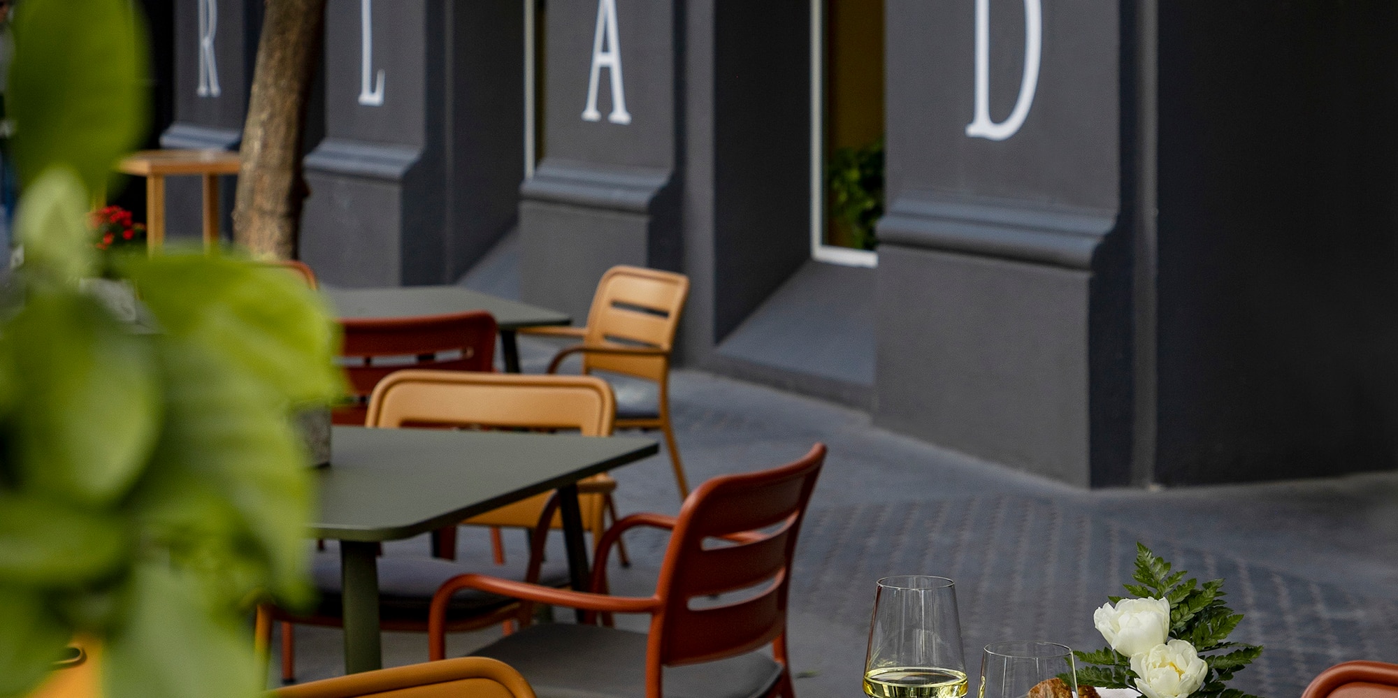 a table with food and wine glasses on it
