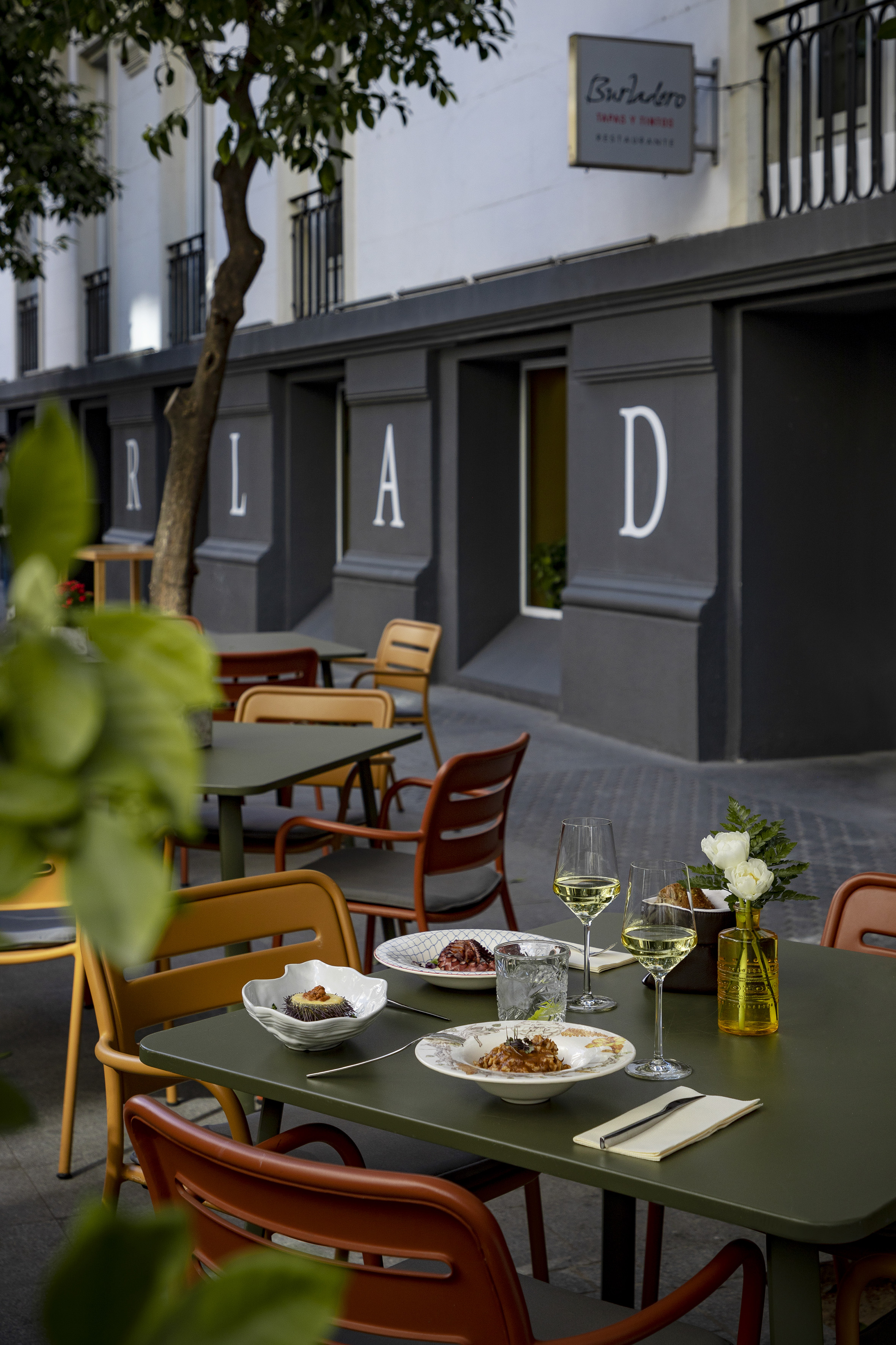 a table with food and wine glasses on it