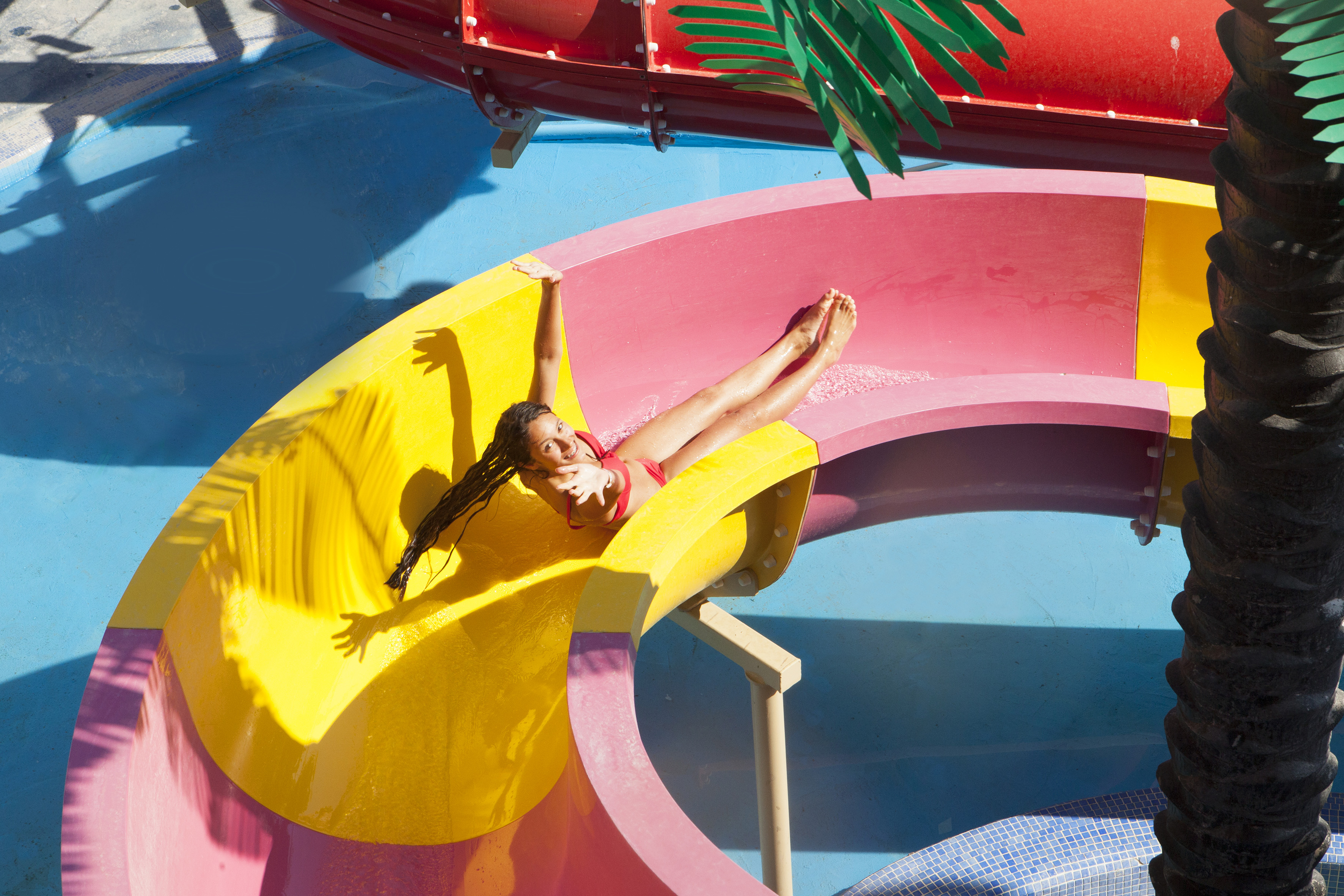 a girl in a swimsuit on a water slide