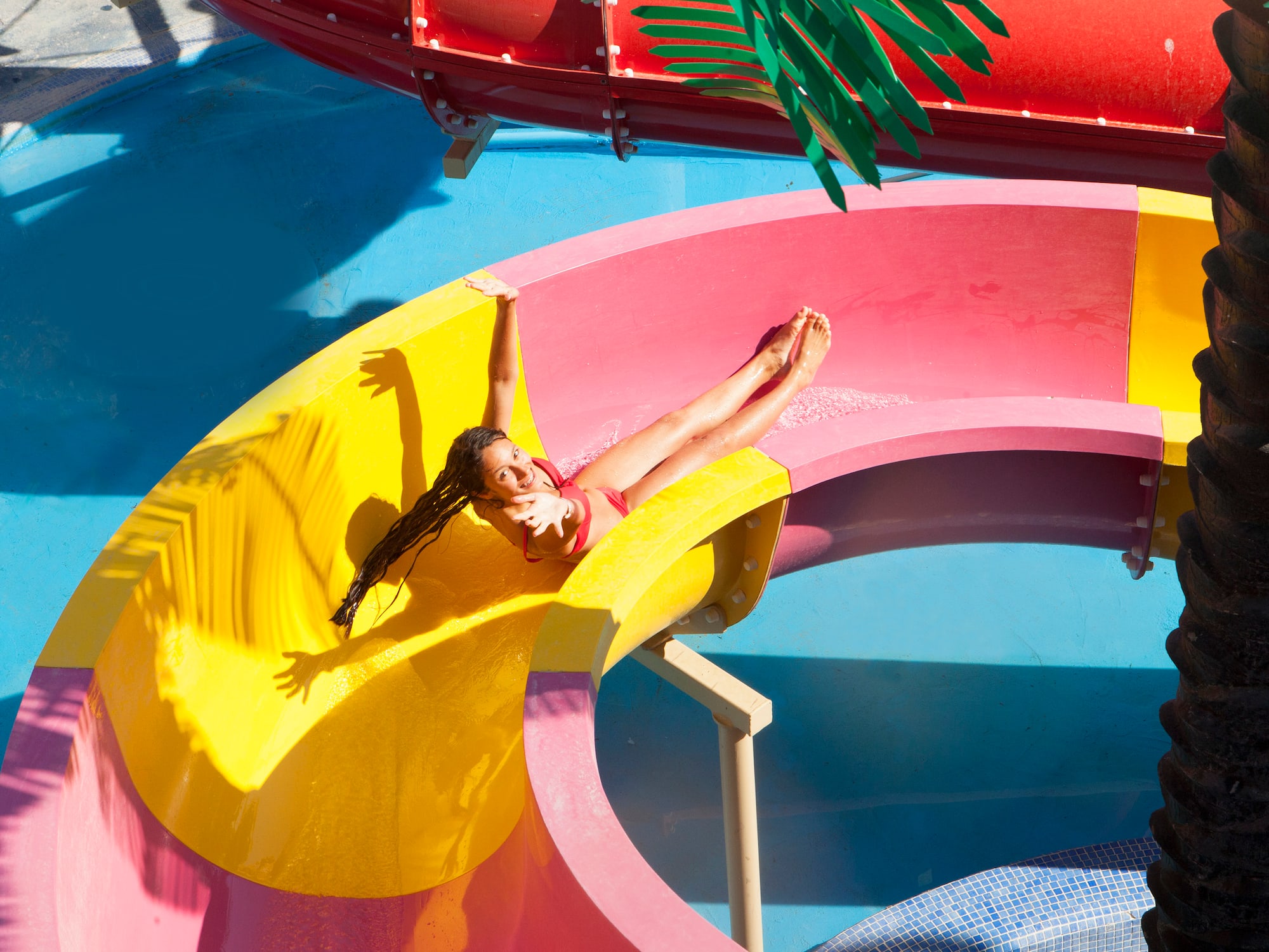 a girl in a swimsuit on a water slide