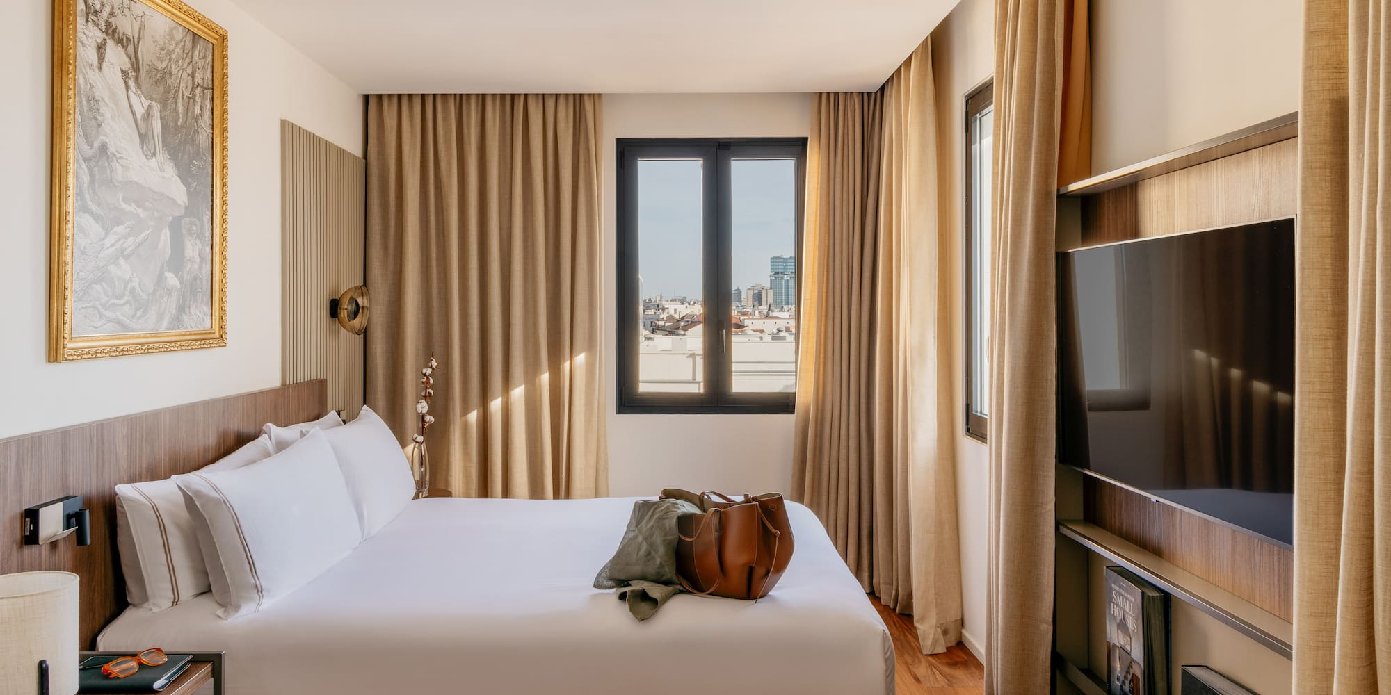 a room with a bed and a television