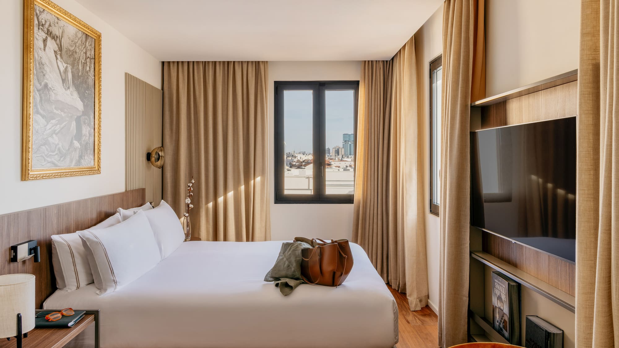 a room with a bed and a television