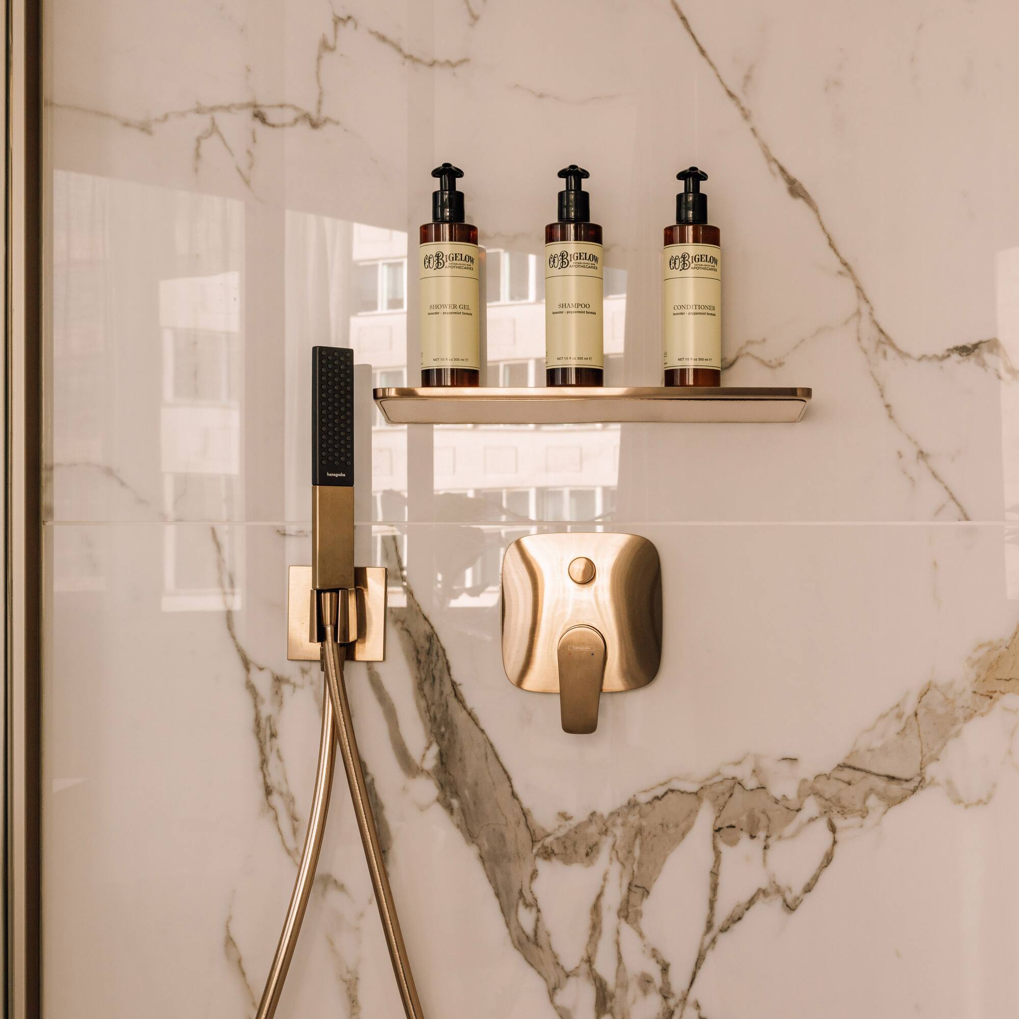 a shower with a shower head and a shower head