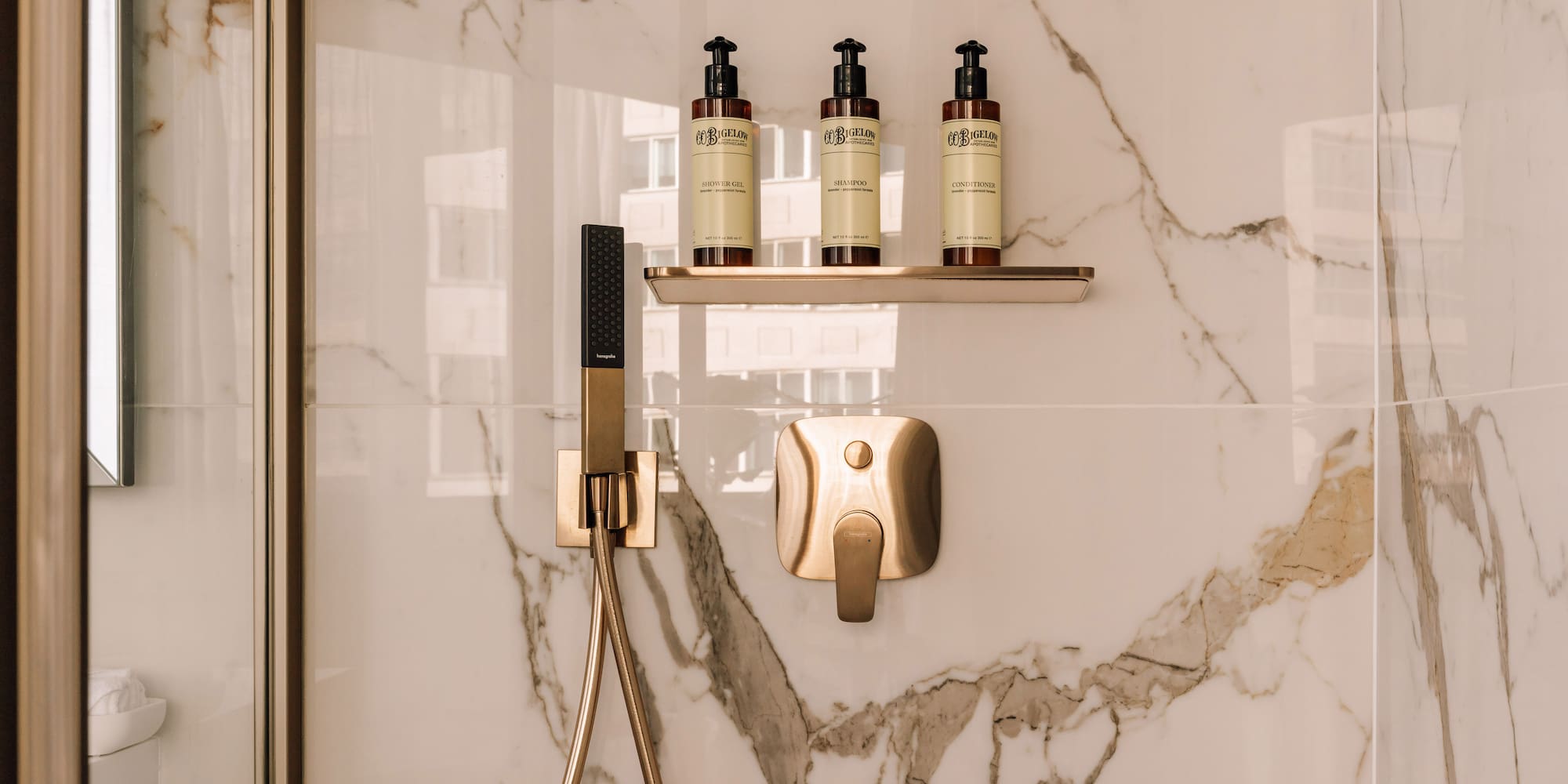 a shower with a shower head and a shower head