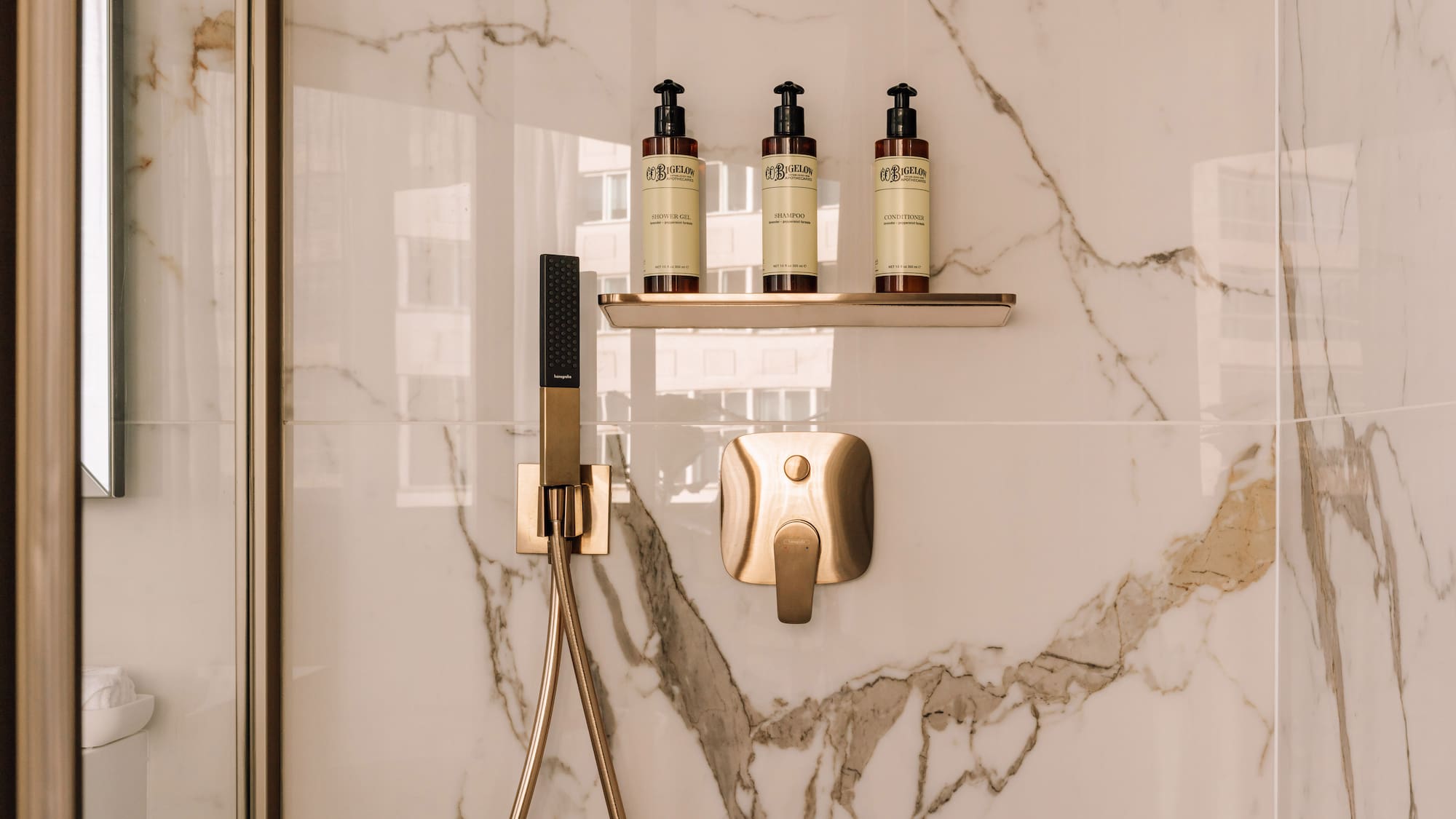 a shower with a shower head and a shower head