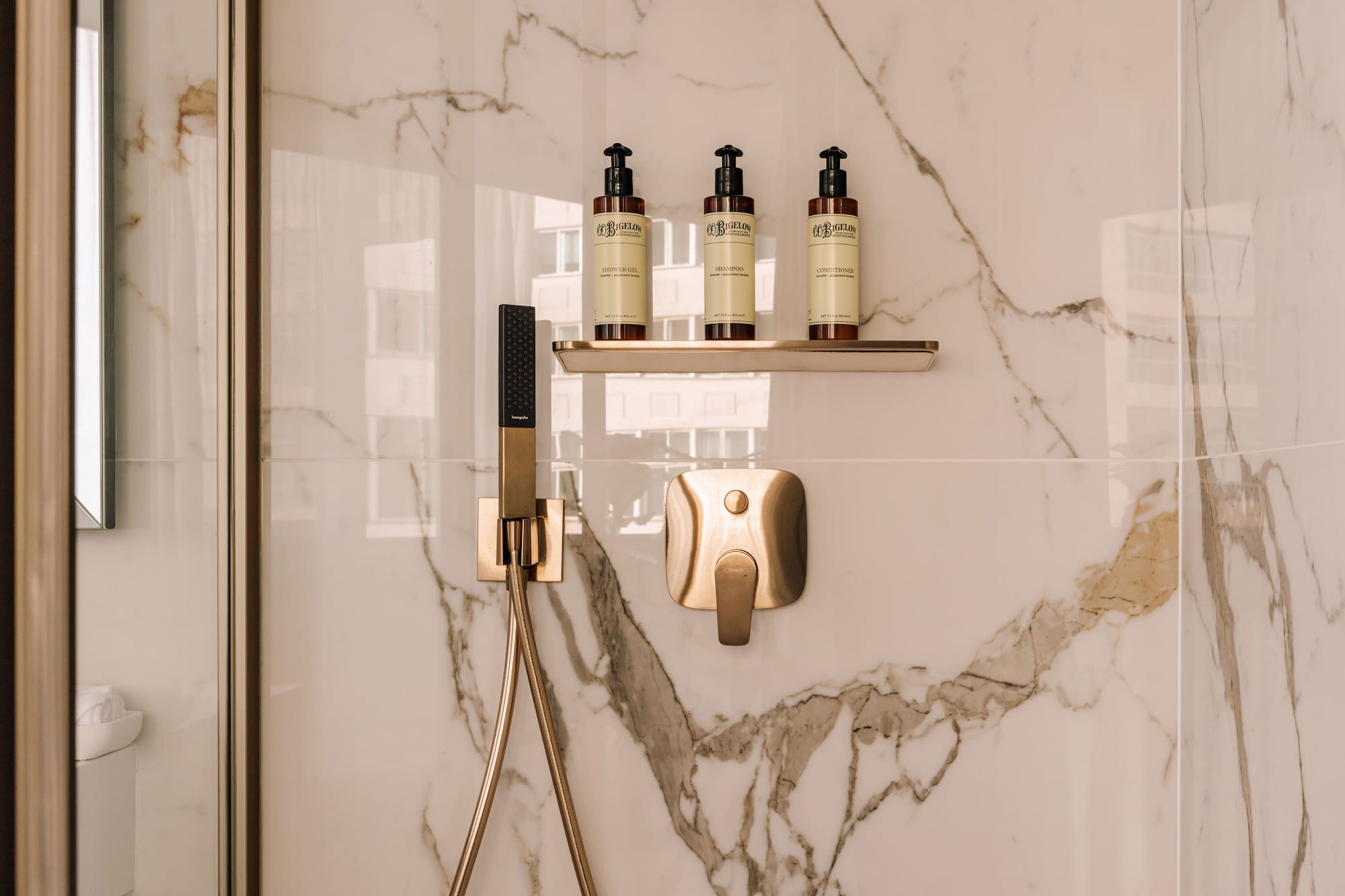 a shower with a shower head and a shower head