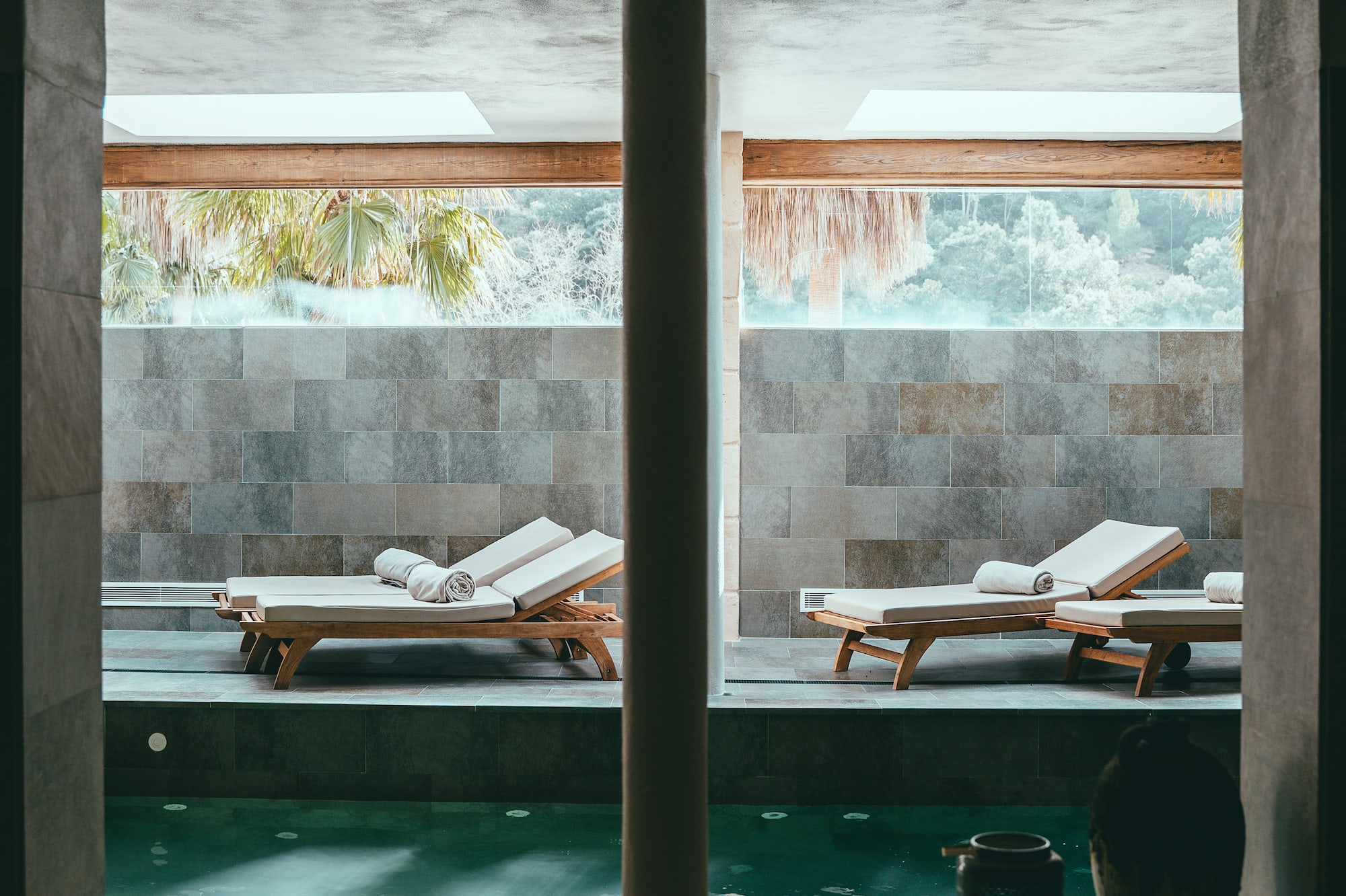 a pool with chairs in it