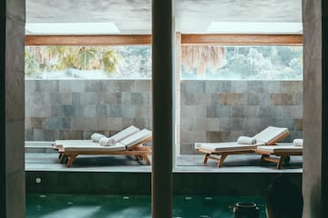 a pool with chairs in it