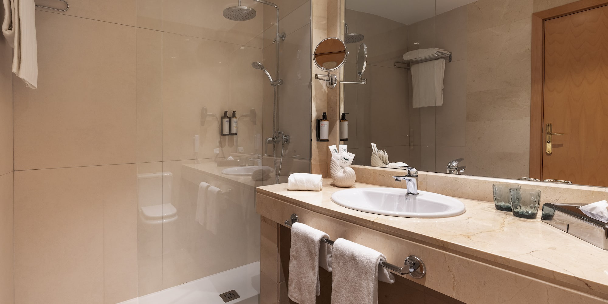 a bathroom with a shower and sink