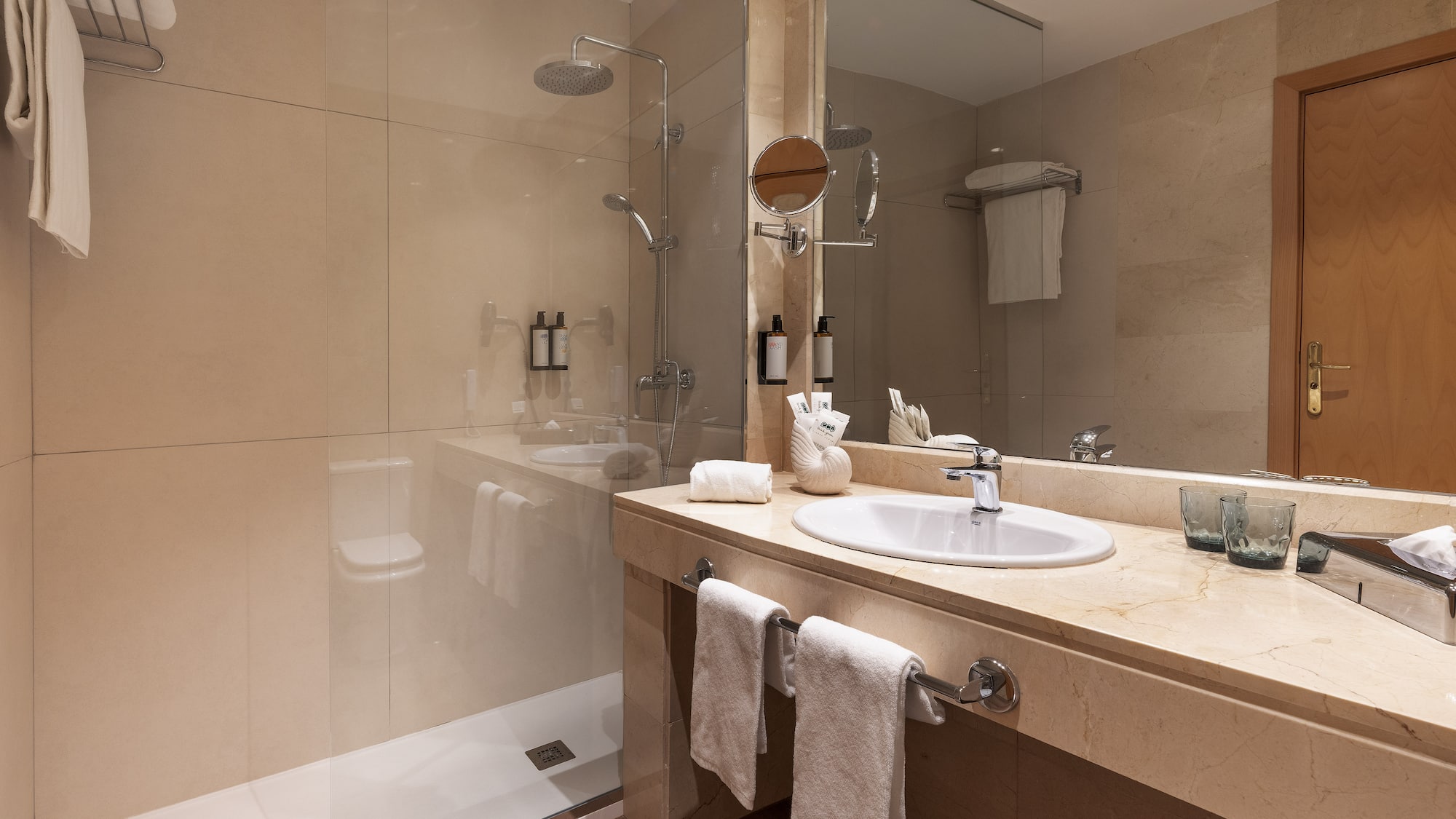 a bathroom with a shower and sink