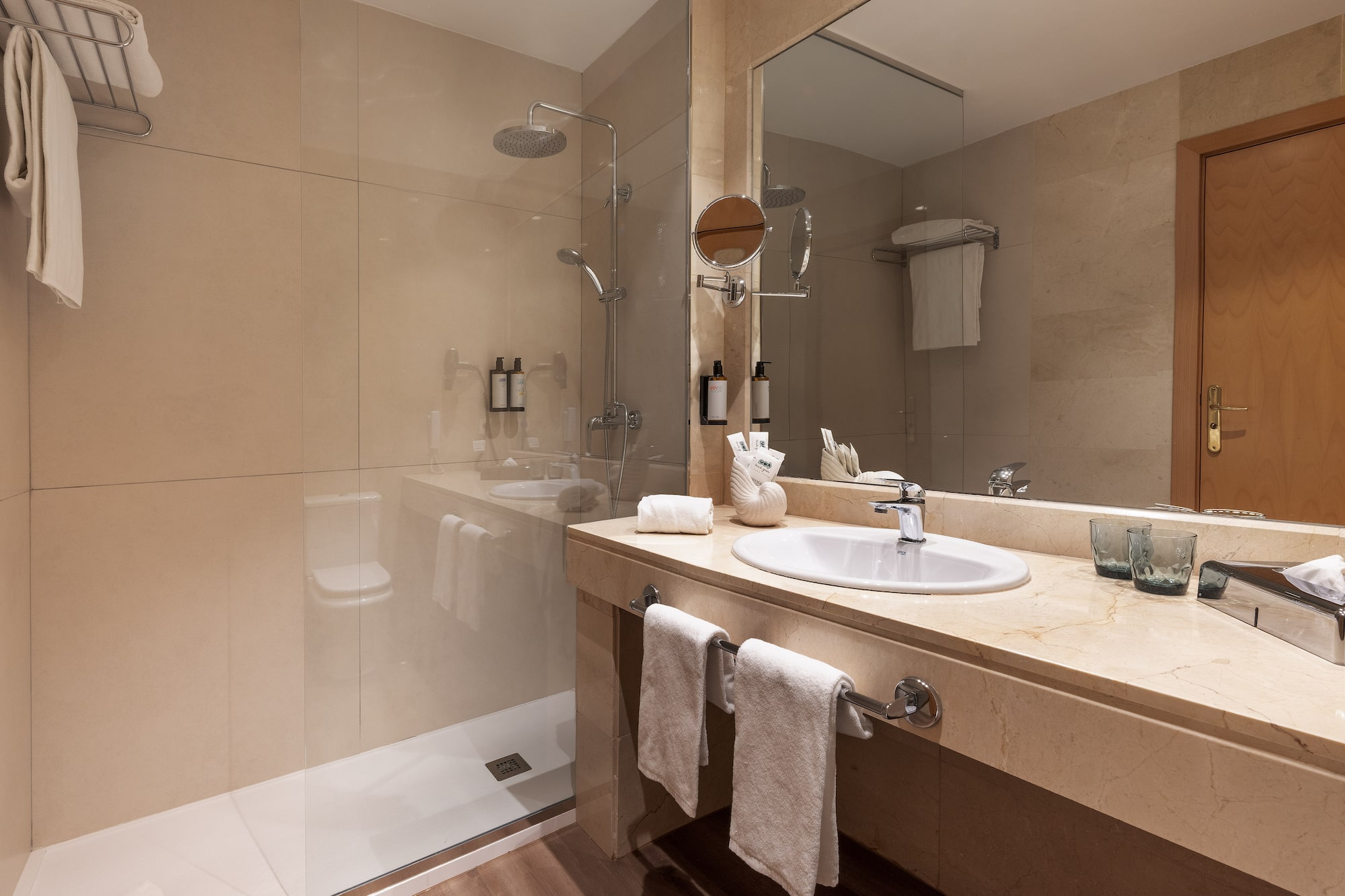 a bathroom with a shower and sink