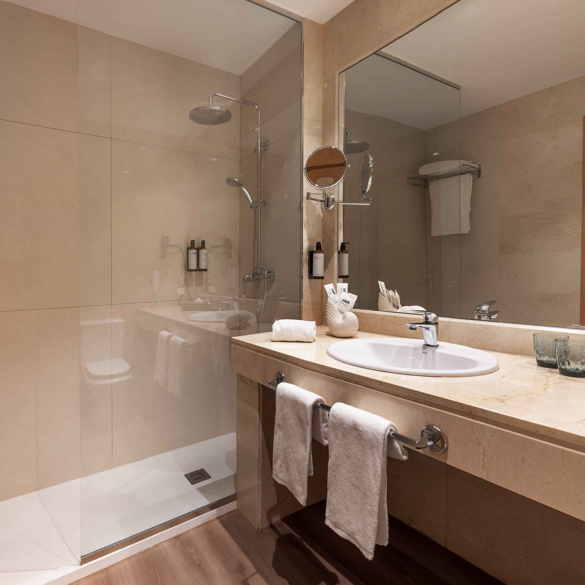 a bathroom with a shower and sink