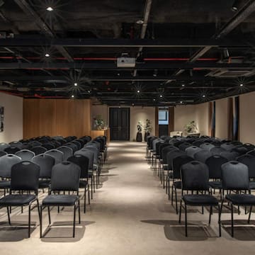 a room with rows of chairs