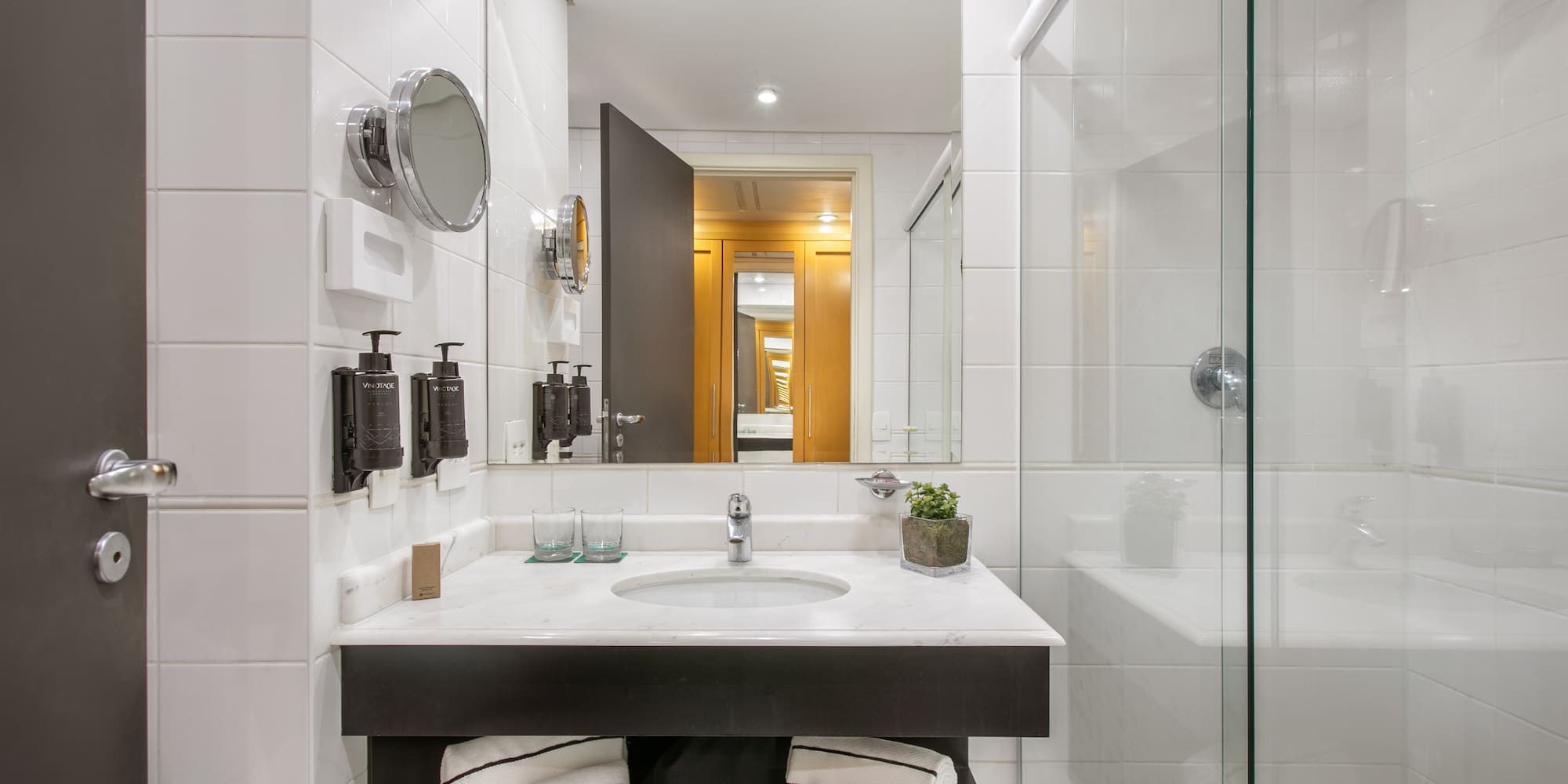 a bathroom with a mirror and sink