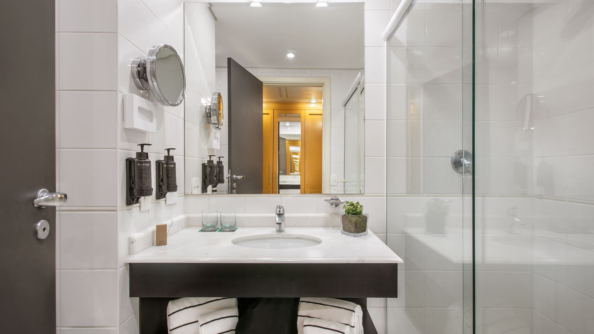 a bathroom with a mirror and sink