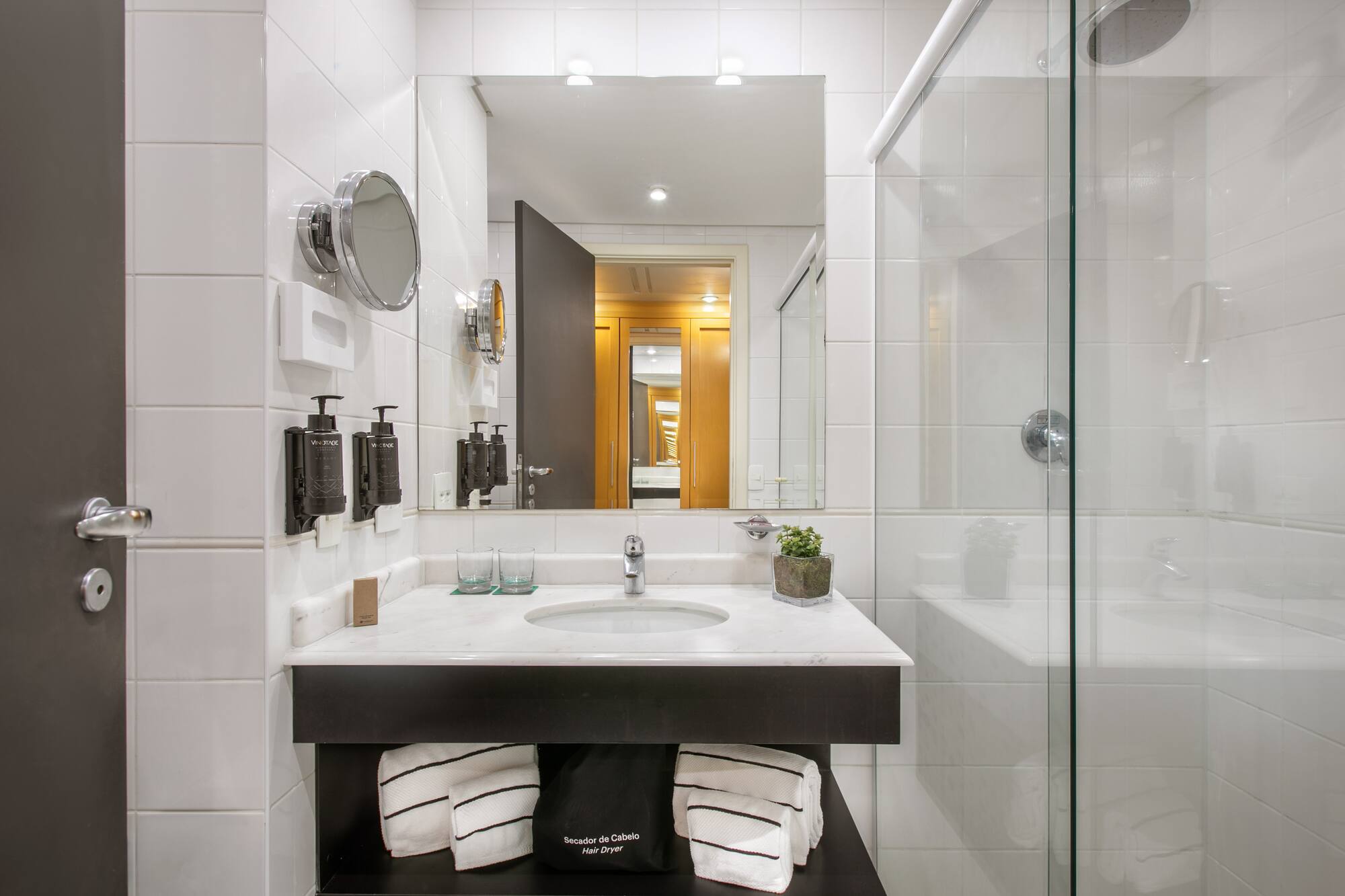 a bathroom with a mirror and sink