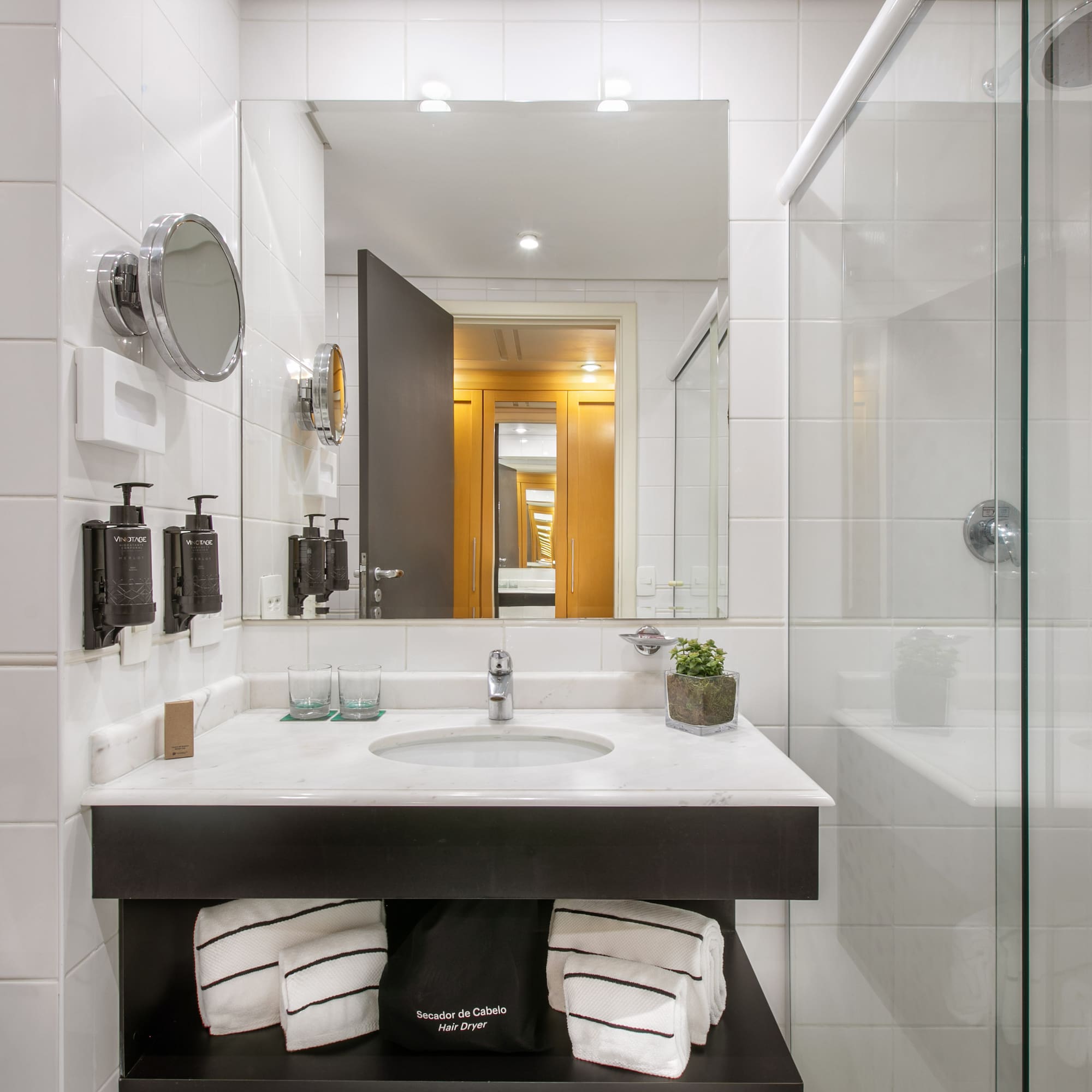 a bathroom with a mirror and sink