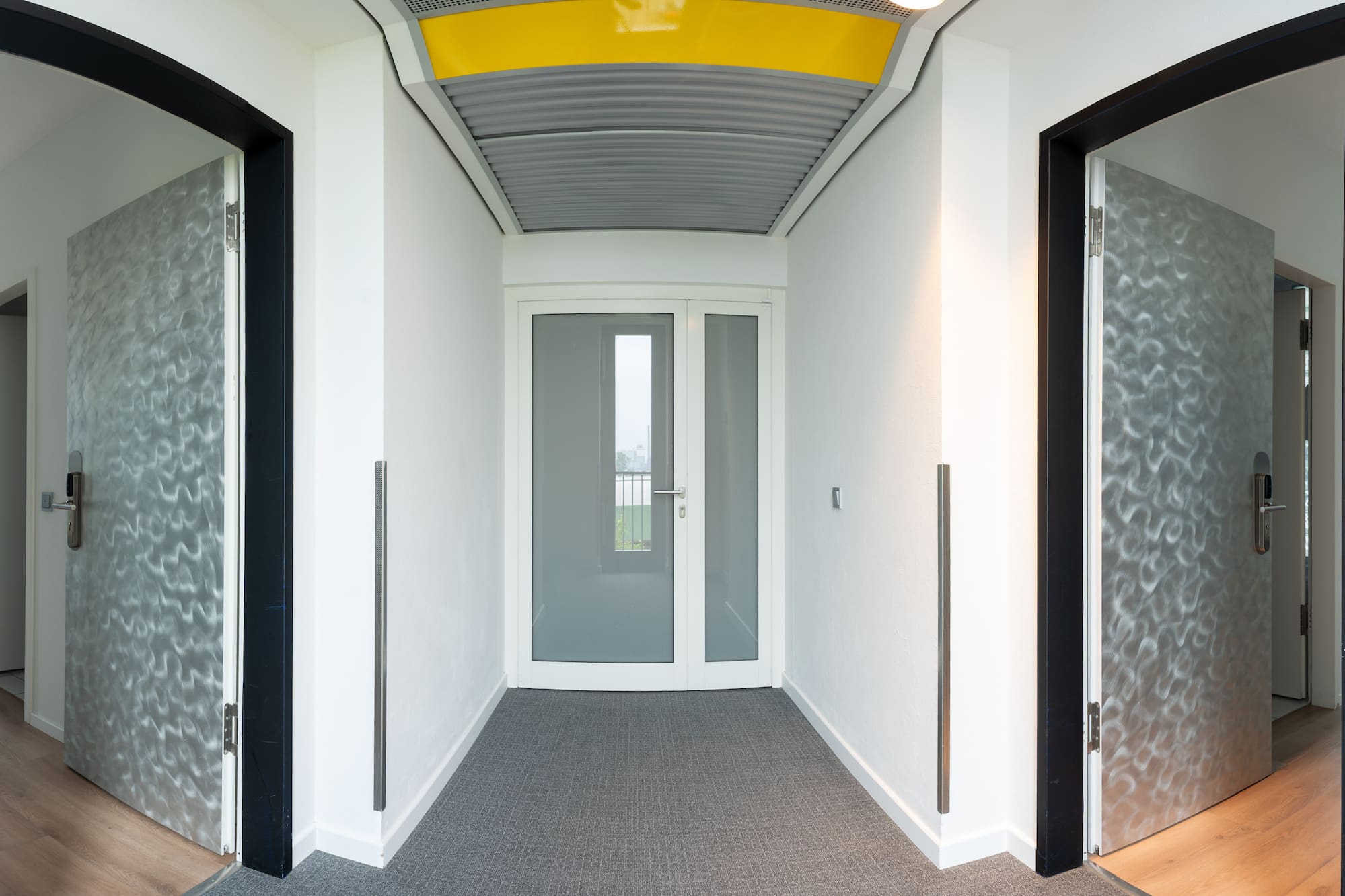 a hallway with two doors