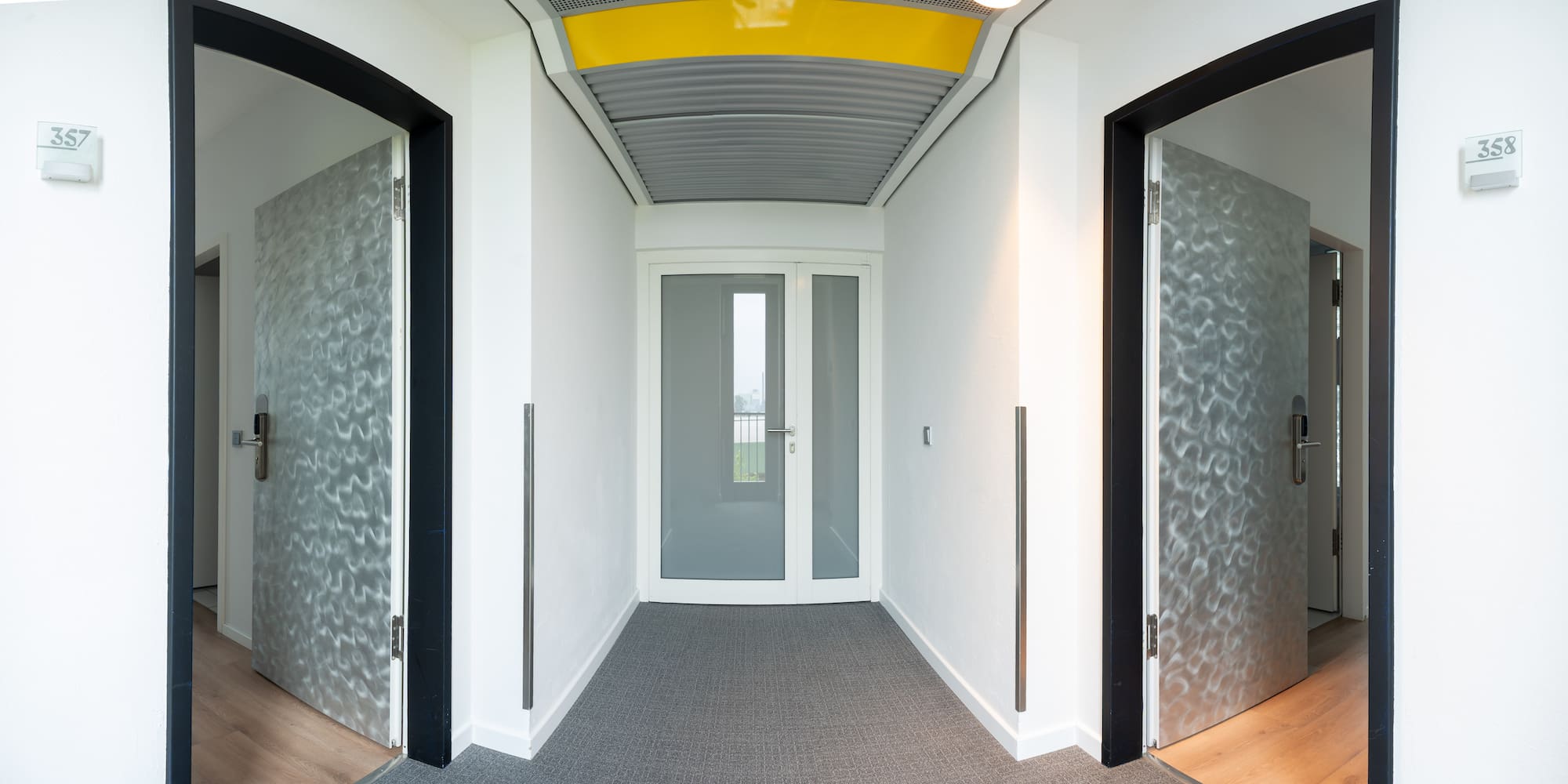 a hallway with two doors