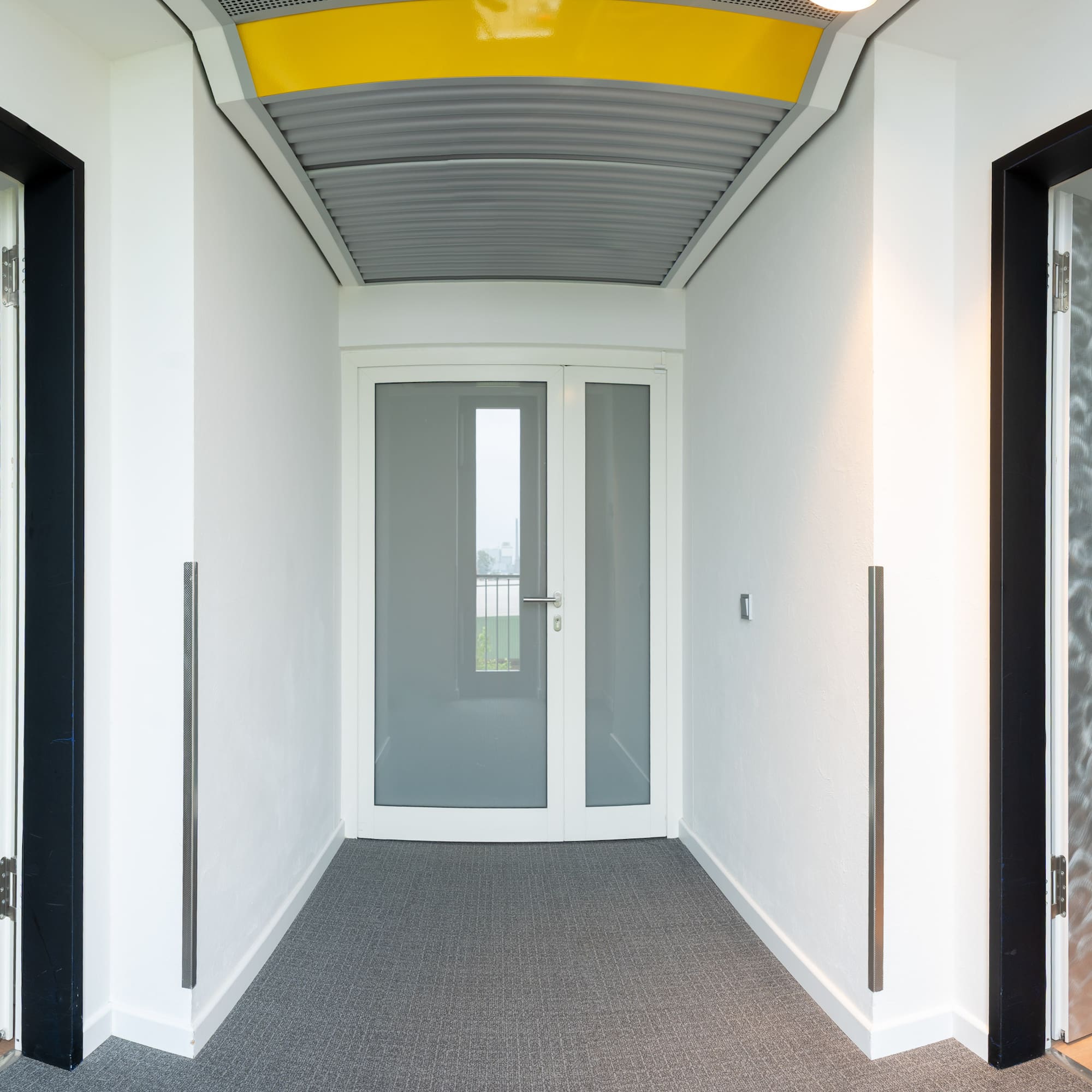 a hallway with two doors