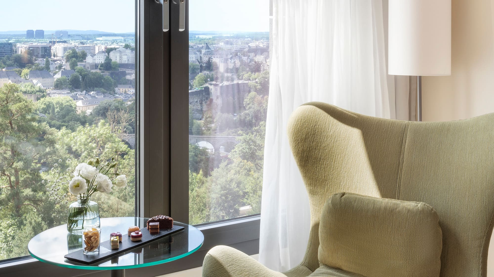 a chair next to a window