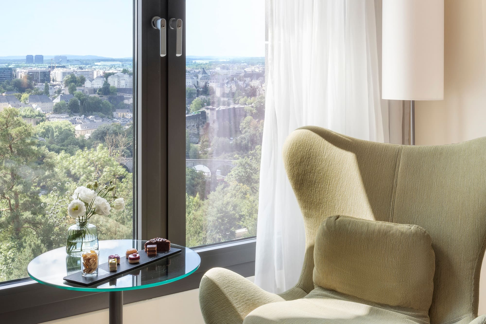 a chair next to a window