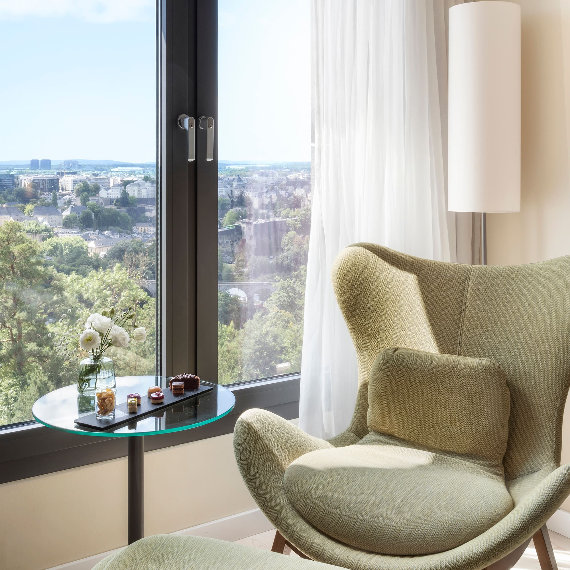 a chair next to a window