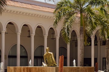 a statue in front of a building