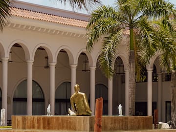 a statue in front of a building